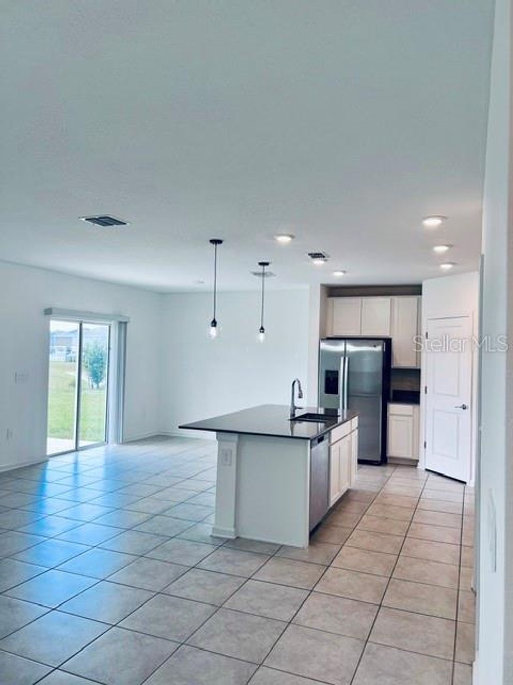 Photo of 865 Daring Drive, Davenport, FL 33837 (MLS # O6408366)