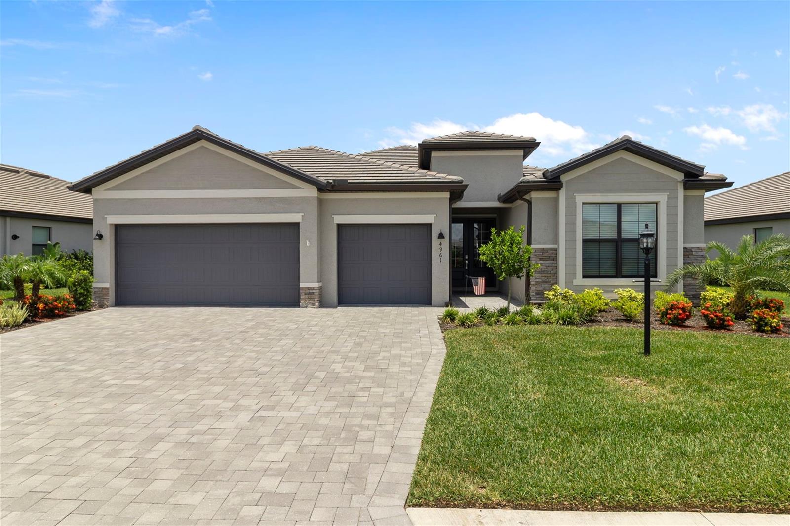 Welcome to your dream oasis in the heart of Lakewood Ranch's premier community, Lorraine Lakes, where luxury living meets resort-style amenities! This stunning 2023 Summerville model offers 2,439 square feet of meticulously designed single-story living, boasting 3 bedrooms, 3 bathrooms, a den perfect for a home office, and a 3-car garage for all your storage needs. Situated on a premium waterfront lot, this home features a chef-inspired kitchen with a 10-foot center island, stainless steel appliances, and a gas range, seamlessly flowing into the expansive great room with elegant tray ceilings, all leading to a screened lanai with serene water views. The primary suite is a true retreat, offering two custom walk-in closets and a spa-like en-suite with dual vanities and a large walk-in shower. The second bedroom also has an en-suite bathroom. Additionally, this home comes with a whole house water softener and a kitchen reverse osmosis system. Living in Lorraine Lakes means enjoying a vibrant, active lifestyle with 24/7 guard-gated security, lawn care, internet and cable included with low HOA fees, and access to an impressive 25,000 sq. ft. amenity center, complete with a café, restaurant and bar, state-of-the-art fitness center, indoor basketball court, putting green, bocce, volleyball, playground, pickleball, multiple pools and more. Located just minutes from top-rated schools, shopping, dining, and only 30 minutes from Florida's pristine beaches and under an hour from St. Petersburg and Tampa, this move-in-ready home offers the perfect blend of luxury, convenience, and community, making it an exceptional opportunity to experience the best of Lakewood Ranch living. Furniture may be purchased on a separate contract, and the seller is flexible with closing dates. Schedule your private showing today and discover the unparalleled lifestyle that awaits!