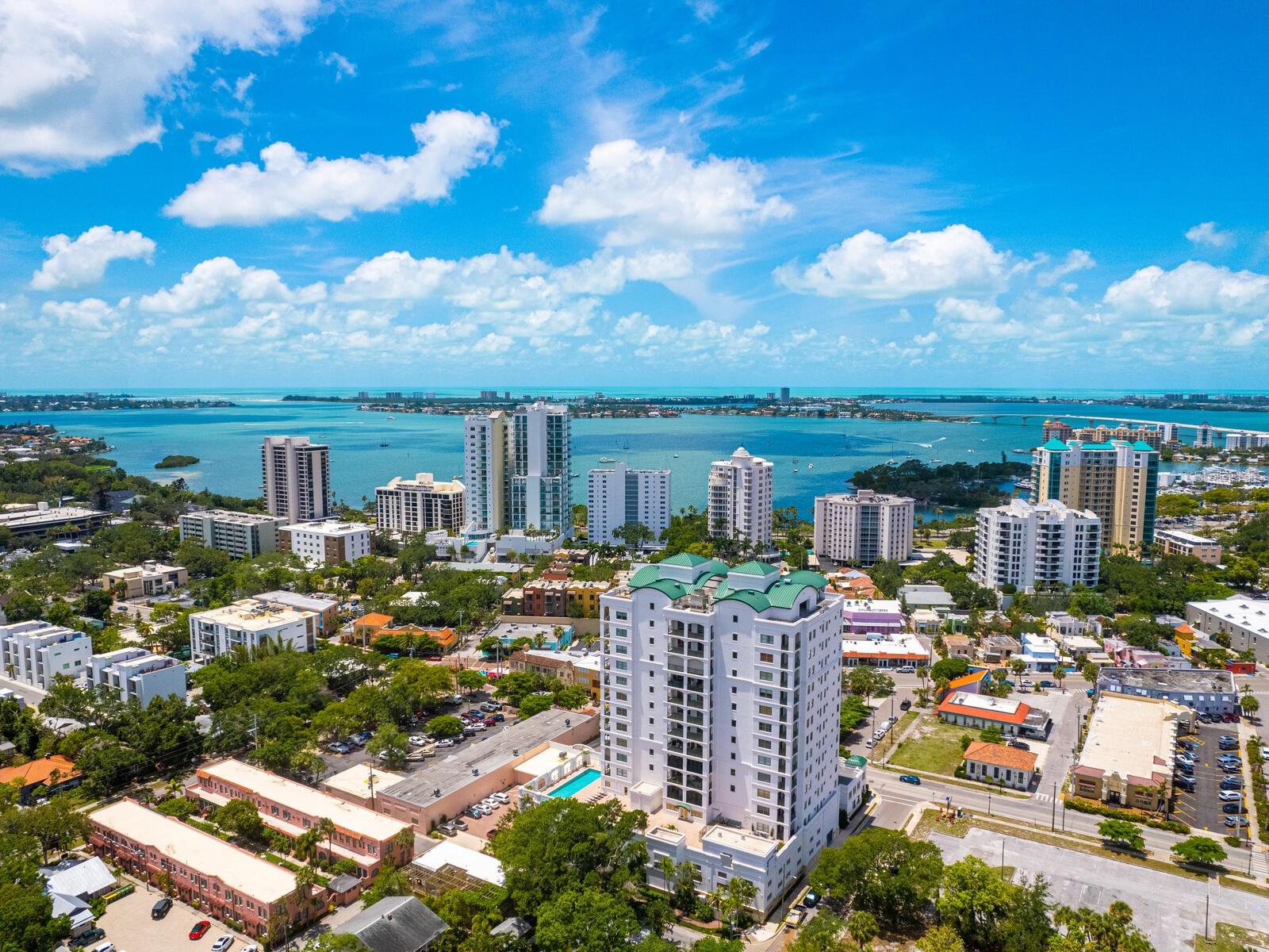 Welcome to the pinnacle of luxury living in the heart of sunny Sarasota, Florida! This exquisite 3-bedroom, 3.5-bathroom end unit condo is where elegance meets modern comfort. Step into your private elevator lobby and be greeted by an open, sunlit space, enhanced by the natural light streaming through windows that face north, east, and west, filling the 3,003 sq. ft. interior with warmth and brightness. The French white oak floors add an air of sophistication, perfectly complementing the thoughtfully designed interiors, each bedroom featuring its own en-suite bathroom and access to spacious private balconies.
Enjoy the convenience and security of keyless entry with a state-of-the-art video intercom system that connects to your smartphone for seamless access. With two on-site building managers, you’ll experience a level of service tailored to your every need. The private tiled balconies are not only perfect for enjoying Sarasota’s sunny weather but also come equipped with Kevlar wireless-activated retractable storm screens, offering hurricane-rated protection. On the west-facing balcony, an automatic sprinkler system allows for hassle-free gardening amidst a living wall, providing the perfect oasis against the backdrop of Florida's coastal breezes.
The three-and-a-half bathrooms have been meticulously renovated, with the primary bath standing out for its luxurious oversized soaking tub, walk-in shower, bidet water closet, and dual vanities. The Primary suite is complemented by two walk-in closets designed for style and organization. Your gourmet kitchen is a dream for any culinary enthusiast, featuring custom Pedini Italian cabinetry and high-end appliances from Bosch, Sub-Zero, and Wolf. Additional touches like a drinking water filtration system and a carbon-filtration range hood enhance both convenience and comfort.
Up-to-date with energy efficiency, the condo comes with newly installed HVAC heat pump units (January 2022) and a water heater (March 2023). In 2022, the building received a full exterior update, including fresh caulking, painting, and sealing for enhanced protection. Two adjacent parking spaces, pre-wired for electric vehicle charging, and a lockable storage unit near the garage add to the convenience of this stunning residence.
Residents enjoy access to an array of amenities on the third floor, including a club room, fitness center, yoga room, sauna, kitchen, heated pool, and a cozy outdoor seating area with a fire pit and grill. On the rooftop, unwind with breathtaking views of Sarasota Bay while taking advantage of the catering kitchen, outdoor dining, lounge areas, and a serene water fountain.
Set in the desirable Burns Court area, this condo offers the best of Sarasota right at your doorstep. Stroll to nearby boutiques, art galleries, yoga studios, a movie theater, and exceptional dining experiences. Downtown Sarasota's vibrant scene and world-class restaurants are just minutes away. For beach lovers, the award-winning sands of Lido Key, Siesta Key, and Longboat Key are just a short drive, offering the perfect coastal escape.
Don’t miss out on this rare opportunity to experience the height of luxury living in Sarasota in a building with fully funded reserves and no assessments. Schedule your private showing today and make this stunning condo your new home!