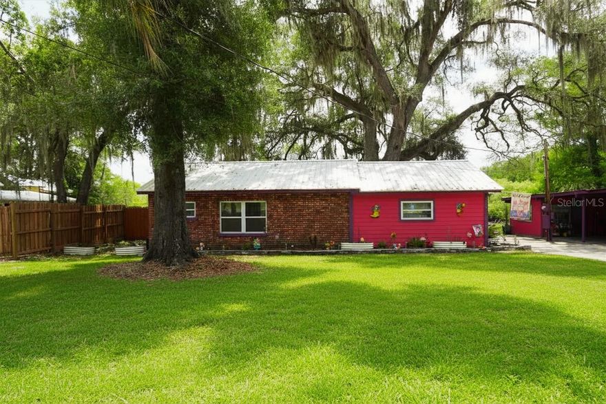 Welcome to your serene waterfront haven in the heart of the picturesque community of Floral City. This delightful home offers a perfect blend of comfort and tranquility, making it the ideal escape from the hustle and bustle of everyday life. Step inside to discover an inviting open-concept layout that is perfect for entertaining. The generous living spaces are flooded with natural light and exude with warmth and charm. The heart of the home boasts a well-appointed kitchen featuring modern appliances, ample counter space, and a convenient breakfast bar, making meal prep a breeze. The primary bedroom features a large walk-in closet with built in shelving for organization as well as an en-suite bathroom with a walk-in shower. The other 2 bedrooms are full of charm and comfort with plenty of space to make it your own and lots of natural light. Step outside to your expansive backyard overlooking the gorgeous Withlacoochee basin. A seawall lines the border of the canal for added safety and utility. In the center of it you will see a private boat ramp to load and unload your boat for recreation. Park your boat in your private, covered boat dock and then clean your fresh catch on the fish cleaning station. Park your RV, ATV's, and vehicles in the large outbuilding with attached carport. Enjoy soaking the stress away in the covered outdoor patio while watching your favorite sports teams or go enjoy some solitude in the bonus building currently being used as an office/guest room. This property has everything you could ask for, so come on down and see it for yourself!

No flood insurance required!