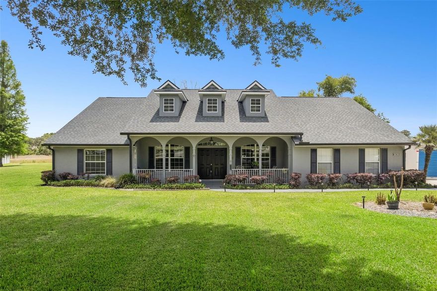 Welcome to the highly sought after Grand Oak Estates!!! This gorgeous home is currently listed UNDER appraised value. This spacious 4-bedroom, 2-bath split-plan home offers a well-designed layout with both formal and casual living spaces. Enter through impressive double front doors into a welcoming sitting area, complemented by a formal dining room—perfect for entertaining. The large kitchen features a breakfast nook and opens to a generous living space. The primary suite includes an oversized shower, tub and walk-in closet, while a dedicated laundry room adds convenience. Enjoy outdoor living with a large lanai overlooking an expansive yard on a .72 acre lot, ideal for relaxing or hosting gatherings. Additional features include a 2-car garage and extended driveway for ample parking. Located near Lake Dora in a beautiful neighborhood known for its large lots, this home combines comfort, space, and a prime setting. Pride of ownership shines throughout this one-owner home. Major updates include a roof replacement in 2023 with a transferable warranty, a water softener installed in 2022, a beautifully updated primary bathroom in 2023, and an upgraded kitchen in 2021.