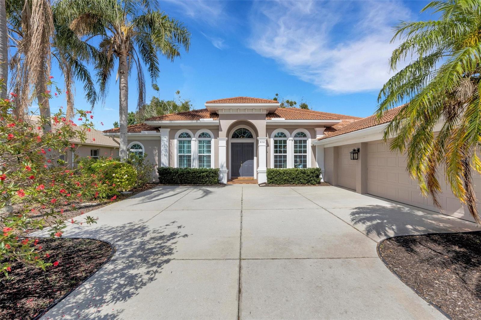 Are you interested in an established and beautifully landscaped gated community without the high fees? Don't miss this perfectly located, updated and upgraded John Cannon built home with 3 bedrooms + den / 3 baths/ 3 car in Edgewater Village. Situated on a .23 acre parcel, the 2402 sq. ft. custom home has a solid wood double door entry, spacious great room with high ceilings, wide plank maple floors, built-in shelves, and imported European doors opening to the expansive outdoor living area. Outside is a private screened lanai with a covered entertaining area and awning offering plenty of space for outdoor enjoyment without the expense or maintenance of a pool! Inside, the modern chef's kitchen once featured in HOUZZ, boasts quartz counters, herringbone backsplash, raised panel cabinets with glass upper cabinets, floating shelves, a coffee bar, wine refrigerator and also plenty of storage. Appliance package includes GE Cafe series range(2025),GE Monogram dishwasher, and an under the counter microwave. A generous owner's retreat boasts his/her walk-in closets bay window with bench storage and a remodeled private master bath with walk in shower. The more than adequate 2nd & 3rd bedrooms have built in shelves in the closets. A sizable home office has glass doors, and offers ample work space for those working from home. Additional Designer/Decorator features include, hurricane rated double pane windows, recessed lighting, Hunter Douglas Silhouette blinds, arched ransom windows, plantation shutters, bay windows, York A/C (2018), hot water heater (2024) and LG high efficiency washer/dryer. The 3 car courtyard entry garage, barrel tile roof, and mature tropical landscaping provide great curb appeal on this very desirable tree lined street. 'The Pointe' in Edgewater Village has very low HOA fees ($150/year) , is in the best location in Lakewood Ranch and is zoned for the top rated schools. The beautiful lakefront community is minutes away from LWR Medical Center, I-75, UTC Mall, Waterside, Lakewood Ranch Main Street and the SRQ Airport. It is also within 30 minutes of World Class Beaches, Dining, Golf, and all the attractions of the Sun Coast. Owner is a licensed Florida Realtor.
