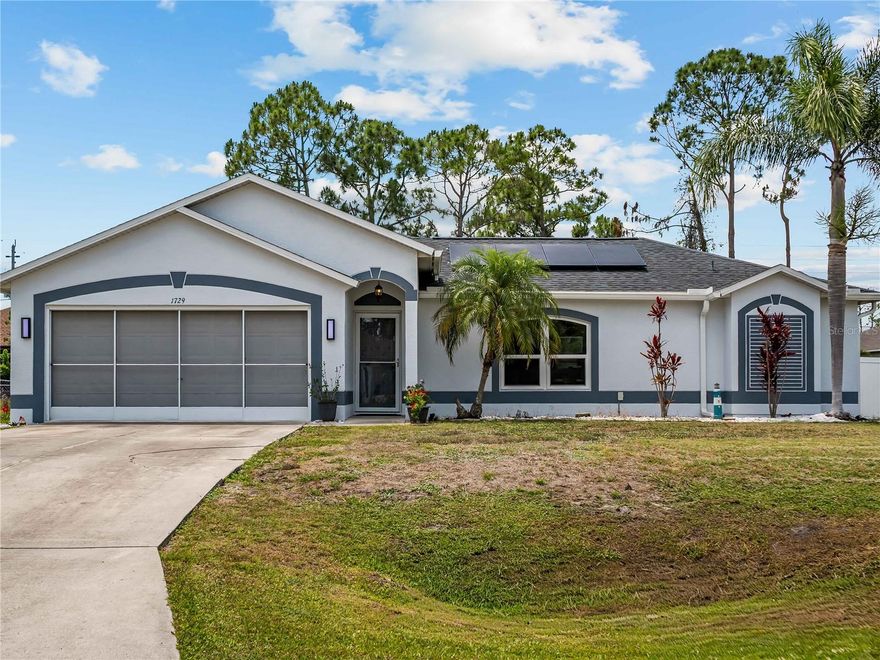 Welcome to 1729 Milan St! Located in the heart of North Port on CITY WATER, this beautifully updated 3-bedroom, 2-bath pool home offers comfort, style, and peace of mind with a long list of recent upgrades. Conveniently situated within a mile of schools, shopping, dining, and everyday conveniences, this meticulously maintained residence is truly move-in ready.

Step inside to discover a spacious open layout highlighted by all-new luxury vinyl plank flooring throughout and an inviting living room filled with natural light. A charming reading nook or flex space just off the main living area can easily serve as a formal dining room, office, or sitting area. The refreshed kitchen features abundant cabinetry, generous counter space, and tasteful 2025 updates that make it both functional and stylish. Adjacent to the kitchen is a large dining/family room area with direct access to the lanai and pool, creating the perfect setup for entertaining.

The split-bedroom floor plan provides privacy and flexibility for family and guests alike. Two generously sized guest bedrooms and a shared bath are located on one side of the home, while the spacious primary suite offers private pool access and a beautifully updated en-suite bath complete with dual vanities.

Outdoor living shines with an oversized screened lanai, expansive pool deck, and a fully fenced backyard featuring durable white vinyl fencing for added privacy. A wired storage shed provides the perfect space for tools, lawn equipment, or a workshop setup.

Major recent upgrades include a new roof (2023), hurricane impact windows (2023), new gutter system, updated overhead plumbing, a 5-year-old A/C system, mini-split A/C in the garage, and a fully paid-off solar system for added energy efficiency and long-term savings. This exceptional property combines modern upgrades, functional living space, and an unbeatable location all in one impressive package.