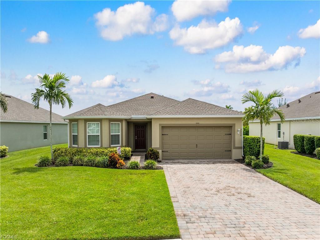 Welcome to your Florida lifestyle retreat in the sought-after gated community of Entrada! Nestled on a quiet cul-de-sac, this home makes a striking first impression with its fresh St. Augustine lawn, paver driveway, and beautifully maintained landscaping. Featuring a 3-bedroom, 2-bath split-bedroom design, this residence offers both comfort and versatility. Inside, you’ll find a spacious floor plan with an abundance of natural light. The eat-in kitchen is bright and inviting, while the open living and dining areas flow seamlessly and feature easy-to-maintain tile flooring. The private owner’s suite includes plush carpeting, an oversized walk-in closet, and a spa-inspired bath with double sinks and a walk-in shower. Two additional bedrooms provide the perfect space for guests, family, or a home office. Step outside to your covered lanai and large backyard—ideal for relaxing or entertaining. The home is equipped with an irrigation system to keep your lawn looking its best year-round. Living in Entrada means enjoying resort-style amenities just around the corner: a gorgeous clubhouse, heated luxury pool with lap lanes, pickleball, tennis, bocce, fitness center, splash pad, and playground. With low HOA fees (including internet), no CDD fees, no flood insurance required, underground utilities, plus golf cart and pet-friendly living—you’ll enjoy the perfect blend of value and lifestyle. All of this in a prime Cape Coral location, just minutes from shopping, dining, beaches, and the vibrant downtowns of both Cape Coral and Fort Myers. Your Florida dream home is ready—schedule your showing today!