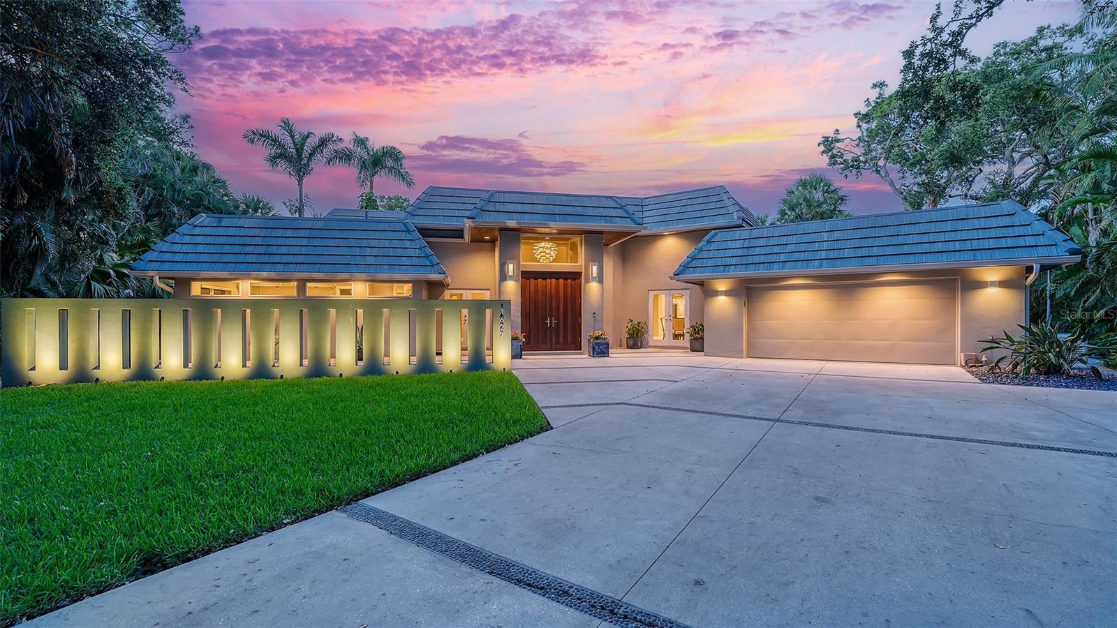 LISTED BELOW RECENT APPRAISED VALUE! Experience Tranquility in The Landings – A Premier Sarasota Gated Community! Welcome to The Landings, one of Sarasota’s most coveted gated neighborhoods just 15 minutes from the vibrant downtown scene. Nestled amid lush landscaping, this beautifully updated 4-bedroom, 3.5-bath residence offers the perfect blend of privacy, sophistication, and comfort. Step through custom-crafted double wood doors into a gracious foyer highlighted by a statement chandelier. The home opens to a spacious living area with soaring 16-foot ceilings and expansive glass sliders that seamlessly connect to the serene pool deck—ideal for indoor-outdoor living and entertaining. The gourmet kitchen is a chef’s dream, outfitted with GE Monogram stainless steel appliances, a 42” Subzero Classic French Door refrigerator/freezer, a center island, wine refrigerator, quartz countertops, double walk-in pantries, and rich wood cabinetry—all designed for function and style. Retreat to the luxurious master suite, thoughtfully positioned for ultimate seclusion. This private haven includes a sitting area, direct access to the pool, a spa-inspired bathroom with a freestanding tub and rain shower, and a versatile adjacent room perfect for an office, nursery, gym, or creative space. Recent renovations add to the home's value and peace of mind, including impact-resistant windows and doors, updated plumbing and electrical systems, and refreshed landscaping and a whole-house generator supplied by a 500-gallon capacity underground propane tank on the premises. It’s move-in ready, so you can immediately start enjoying the exceptional Landings lifestyle. Surrounded by nature and just moments from Sarasota Bay, this sought-after community feels worlds away—yet is close to Siesta Key’s beaches, top-rated schools, gourmet markets, and dining.