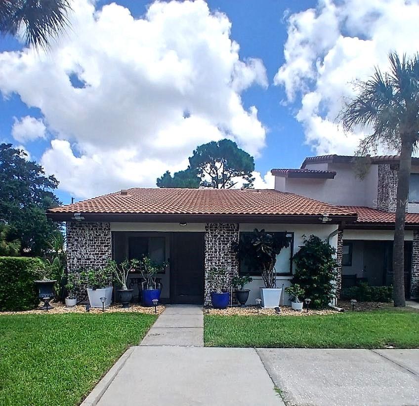One look at this lovely 2 bedroom/2 bathroom end villa and you will want to call it home. Enjoy your morning coffee on the front screened porch or relax at the end of the day on the back screened porch. This roomy villa boasts a spacious kitchen with plenty of counterspace for cooking and cabinets for storage, upgraded ceiling fixtures, full size washer and dryer, split bedroom floor plan, window treatments, walk-in closets in both bedrooms with custom features, and assigned parking right outside of the front door. The separate storage area (located off the front porch) and ample closet space provide for generous storage.
The community features 2 swimming pools, basketball court, playground, and clubhouse. There is no age restrictions and large dogs are welcome. Conveniently located to beaches, restaurants and plenty of shopping.
This villa offers an opportunity for investors and homeowners, with no leasing restrictions and the option for short-term rentals, making it an attractive choice for those looking to generate additional income.