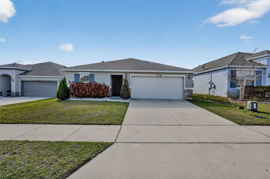 Short Sale. *** Well-maintained 3-bedroom, 2-bath home built in 2020 featuring a desirable open and SPLIT FLOORPLAN designed for both functionality and privacy. The spacious layout offers seamless flow between the living, dining, and kitchen areas, making it ideal for everyday living and entertaining. The kitchen features GRANITE countertops, stainless steel appliances, and AMPLE CABINET SPACE and pantry, all overlooking the main living area. The split-bedroom design provides separation between the primary suite and secondary bedrooms. The primary suite includes a private en-suite bath and walk-in closet. Enjoy outdoor living with a COVERED PATIO overlooking a LARGE BACKYARD, offering plenty of space for gatherings, pets, or future improvements. Additional features include solar panels for energy efficiency and a water softener system. The home has been very well maintained and offers modern construction throughout. Conveniently located in Davenport with easy access to major highways, shopping, dining, and Central Florida attractions. Short sale – subject to lender approval.