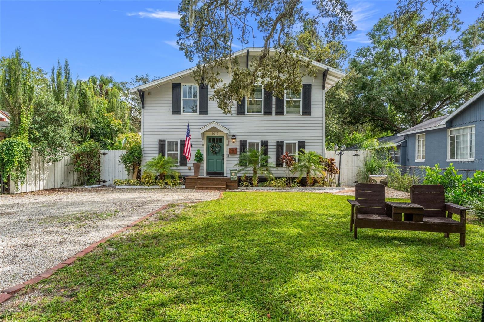 Tucked beneath a canopy of towering oaks on one of Seminole Heights’ most picturesque streets, this beautifully updated 4-bedroom, 2-bath home offers the perfect blend of historic character and modern convenience. Living in Hampton Terrace means more than just owning a home — it’s joining a community where neighbors gather for parades, holiday traditions, and evening strolls around Lake Roberta just steps away. Inside, Craftsman details pair seamlessly with thoughtful upgrades. The open floor plan flows effortlessly into a custom bar and dining nook with built-in storage — ideal for entertaining. Updates include newer paint, flooring, lighting, and stainless appliances, plus tons of storage with built-ins and a spacious walk-in closet rarely found in the Heights. Step outside to your private backyard retreat: a covered entertaining space with a bar, cooking area, and fans, a golfer’s dream three-hole putting green on pet-friendly turf, and a cozy fire pit area to wind down the evenings. Even better — energy-efficient solar panels help keep utility costs low so you can fully enjoy Florida living. All of this in a prime location just minutes from Seminole Heights’ favorite restaurants, 10 minutes to Armature Works and the Riverwalk, and 15 minutes to TPA. This is the Heights lifestyle at its very best.
