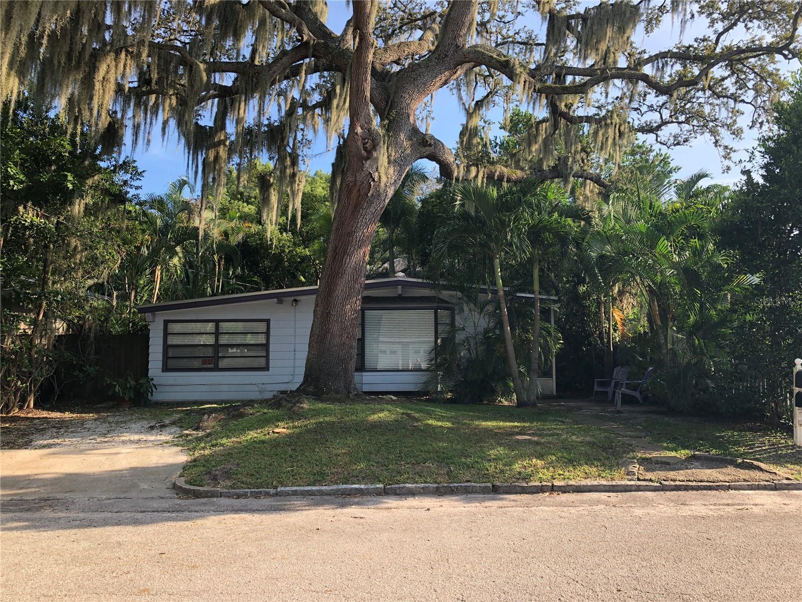 Hot Location! No Flood Zone! This Old Northeast Neighborhood property features a front
house & two rear, legal apartment units set within a long lot shaded by live oak trees and
tropical palms. The central courtyard has room for an in-ground spa. The rear yard has
room for a pool. All three units have central ac, dishwasher, in-unit stacked laundry, and
sun exposure on four sides. Live in the front house and rent the two apartments!
The front house is a mid century marvel with two bedrooms, one baths, updated kitchen/
family room, living room w/ bay window, and laundry room off the rear. The circulation
flow from the living spaces to the central courtyard provide an excellent sequence of
spaces to entertain family and friends. The rear house, a Craftsman, contains two
apartments - an upstairs two bedroom/one bath and a ground floor one bedroom/one
bath. Both apartments have been updated. The upper apartment has original hardwood
flooring. There are two, off-street, parking spaces and room for three more in the rear.
Street parking is also available. Potential 2025 annual, gross income from rent: $65,316.
The property is just steps to the Sunken Garden and Crescent Lake Park, a short walk to
Tampa Bay beaches and parks, and a longer walk to vibrant Downtown St. Pete shops,
restaurants and entertainment. One of a kind in one of St. Petersburg's finest
neighborhoods.