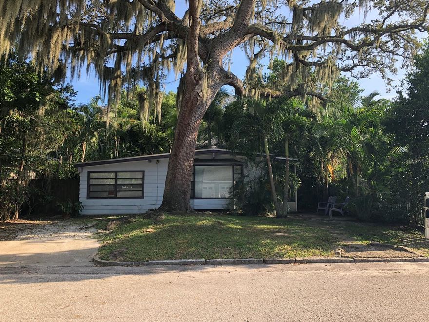 Hot Location! No Flood Zone! This Old Northeast Neighborhood property features a front
house & two rear, legal apartment units set within a long lot shaded by live oak trees and
tropical palms. The central courtyard has room for an in-ground spa. The rear yard has
room for a pool. All three units have central ac, dishwasher, in-unit stacked laundry, and
sun exposure on four sides. Live in the front house and rent the two apartments!
The front house is a mid century marvel with two bedrooms, one baths, updated kitchen/
family room, living room w/ bay window, and laundry room off the rear. The circulation
flow from the living spaces to the central courtyard provide an excellent sequence of
spaces to entertain family and friends. The rear house, a Craftsman, contains two
apartments - an upstairs two bedroom/one bath and a ground floor one bedroom/one
bath. Both apartments have been updated. The upper apartment has original hardwood
flooring. There are two, off-street, parking spaces and room for three more in the rear.
Street parking is also available. Potential 2025 annual, gross income from rent: $65,316.
The property is just steps to the Sunken Garden and Crescent Lake Park, a short walk to
Tampa Bay beaches and parks, and a longer walk to vibrant Downtown St. Pete shops,
restaurants and entertainment. One of a kind in one of St. Petersburg's finest
neighborhoods.