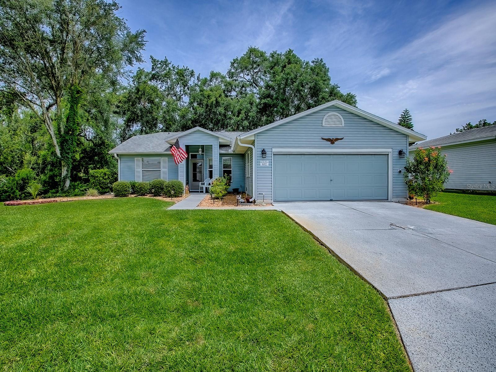 Welcome home to PENNBROOKE FAIRWAYS, an active 55 plus gated community. This home is a BEAUTIFUL 3 BR/2 BA with SPLIT FLOOR PLAN and large EAT-IN KITCHEN. You'll notice the beautiful garden area in the front of the home as soon as you drive up. Relax and enjoy the tranquil PARK-LIKE SETTING from your acrylic enclosed lanai, which has a mini-split HVAC unit giving you 220 sf more living space. To the left is CONSERVATION LAND with only trees so no neighbors. It sits on a slightly OVERSIZED LOT given more space and privacy between neighbors in back. BUT no worries because the HOA handles lawn mowing. The kitchen and bathrooms have GRANITE COUNTERS and oak cabinets. The kitchen cabinets and pantry closet have PULLOUTS for easy access. Newer STAINLESS STEEL APPLIANCES in kitchen. The kitchen, bathrooms and lanai have TILE FLOORING and the rest of house has soft light color CARPETING. The only exception is the entry hall which is LVP. The paint colors are neutral and soothing throughout. The newer Samsung washer and dryer are in the garage which has a retractable screen door and pull down attic stairs. The 4 seater ELECTRIC CLUB CAR GOLF CART cart is available for sale separately. The golf cart has 2024 batteries and a water maintenance system. There is a ceiling fan in the garage. The water heater was replaced in 2023, the HVAC replaced in 2020 and roof in 2014. If not familiar with PENNBROOKE FAIRWAYS, you're missing out! It's conveniently located near The Villages Community, with shopping, restaurants and 15 minutes from Brownwood Town Square. Pennbrooke is an active 55+ gated community with three golf courses open to the public--two 9-hole executive courses and one regulation 9-hole course. There is a golf pro shop, grille, 2 recreation centers, 2 pools, 2 hot tubs, softball, tennis/pickleball, shuffleboard, fitness center, library and hair salon. There is a COMMUNITY GARDEN for those with a green thumb. BONUS for RV/Boat owners--FREE RV/BOAT STORAGE with dump and wash facilities. HOA fee of $255/mo. includes lawn cutting and edging as well as cable and internet! Pennbrooke offers a plethora of classes, concerts, trivia, bingo, golf leagues and groups, and many clubs so there is surely something for everyone. Call to set up your private tour today! You'll be impressed!