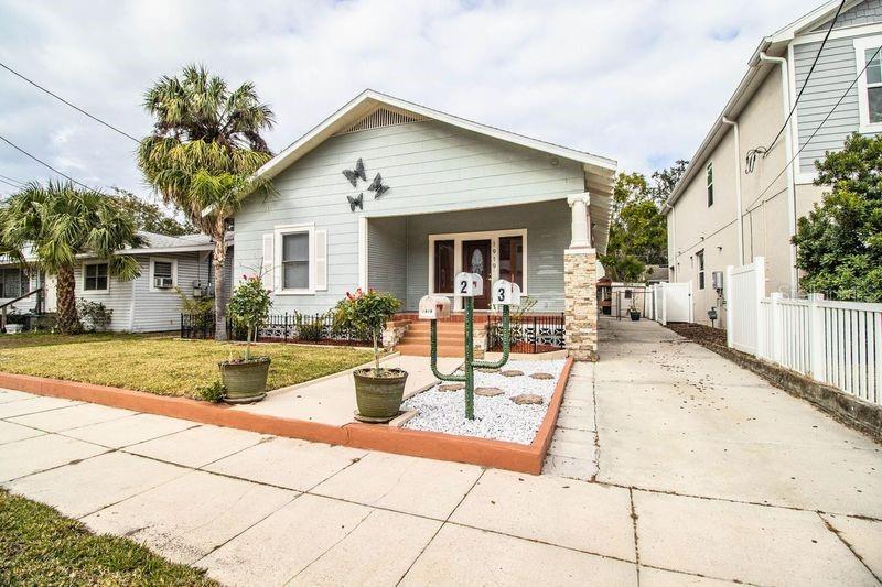 Price reduction and new pictures (showing furnishings) have been added. Location! Location! Location! Historic Hyde Park income property (with three units) convenient to Soho dining entertainment district, WalMart Neighborhood Mart, Buddy's Coffee Shop, and Ducky's. Downtown, Bayshore, and Old Hyde Park village are minutes away. The main house is a 2/2 with formal dining, living room, and large kitchen. There is an indoor laundry closet (washer and dryer included). The main house has rear screened porch and rear patio. The 2 story building in the rear of property has two units. Unit 2 (downstairs) is a 1/1 with large rooms. Unit 3 (upstairs) is a 2/1. Units 2 and 3 share the 10 x 10 laundry room with washer and dryer (located downstairs). All tenants share the fenced courtyard and outdoor grill. Each unit has a storage shed. Courtyard is fenced. Dining room has gas fireplace. Attic access is a door in the hallway. Laminate flooring in house, tile in units 2 and 3. There is parking in the driveway and also ample street parking. Main house had new roof installed November 2024. Rear building with units 2 and 3 had roof installed 2021. Each unit has a separate electric meter. Units 2 and 3 share water meter (owner is currently paying water for unit 2 and 3 meter. Exterior lights on the home are LED motion sensor lights. House was tented for termites in 2022 (house only). Good for 7 years. Home was replumbed 2015. Home has the old main, but new plumbing (from city water meter to house is original plumbing). Home was rewired in 2010. Irrigation is connected to the main house water line which is metered to the main house. Windows in main home are doub le paned (20 windows) Seven windows are still original and have not been replaced. Seller has architectural (blueprint) drawing of a proposed townhouse on the property, if requested. Large mirror in dining room does not convey with sale. Pictures for upstairs unit 3 are not available due to tenant on site.
