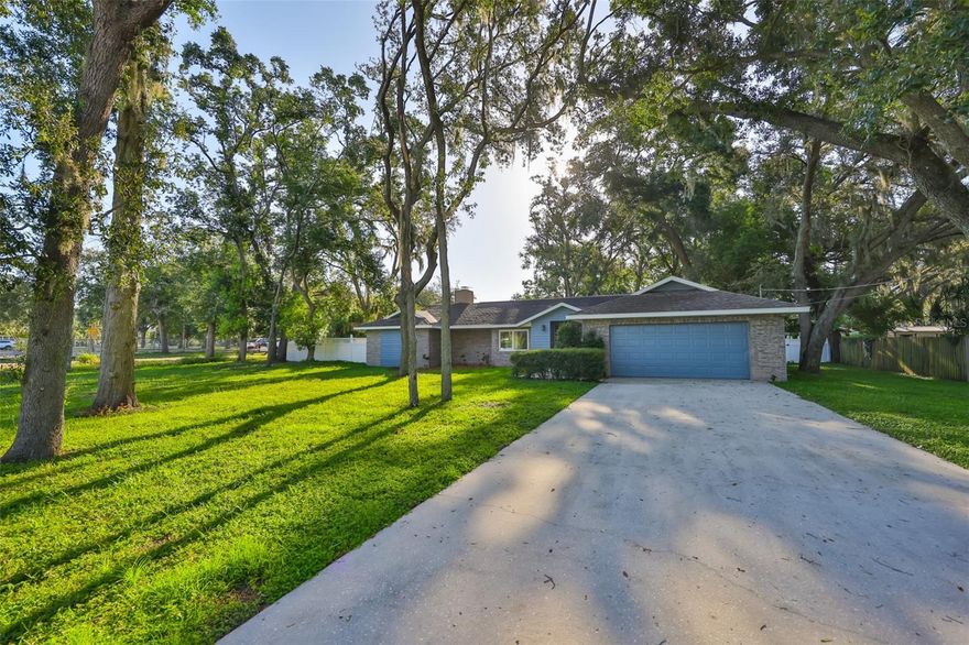 *** $10,000 in Seller Concession *** Welcome to this beautifully maintained 3-bedroom plus den, 2-bath, 2-car garage home on a spacious half-acre corner lot in the quiet and desirable North Brandon/Seffner area. Offering over 2,400 sq. ft. of living space, this turn-key property combines comfort and peace of mind with thoughtful upgrades throughout. The large great room features vaulted ceilings, rich hardwood floors, and a cozy fireplace, while the kitchen boasts granite countertops, a breakfast bar, and a pass-through to the Florida/bonus room for easy entertaining. A split-bedroom layout provides privacy, and the master suite offers two walk-in closets, dual vanities, a jetted tub, and a separate walk-in shower, with a private den or office just steps away—perfect for remote work or relaxation. Recent updates include a 5-year-old whole-house generator with propane tank and transferable service contract, a 3.5-year-old A/C unit with new UV light, serviced with professionally sanitize ducts, a brand-new refrigerator and garbage disposal, energy-efficient double-pane, double-hung windows, a 9-year-old roof, and an electric vehicle charging hookup in the garage. Additional highlights include tile floors in the master suite and den, carpet in the secondary bedrooms, ceiling fans in every room, a laundry/mudroom off the garage, a fully fenced backyard with storage shed, and ample space for RV or boat parking—all with no HOA or deed restrictions. Ideally located within walking distance to the elementary school and just minutes from middle and high schools, shopping, dining, and major roadways, this home offers the perfect blend of peaceful suburban living and everyday convenience. Schedule your private showing today—this rare find won’t last long!
