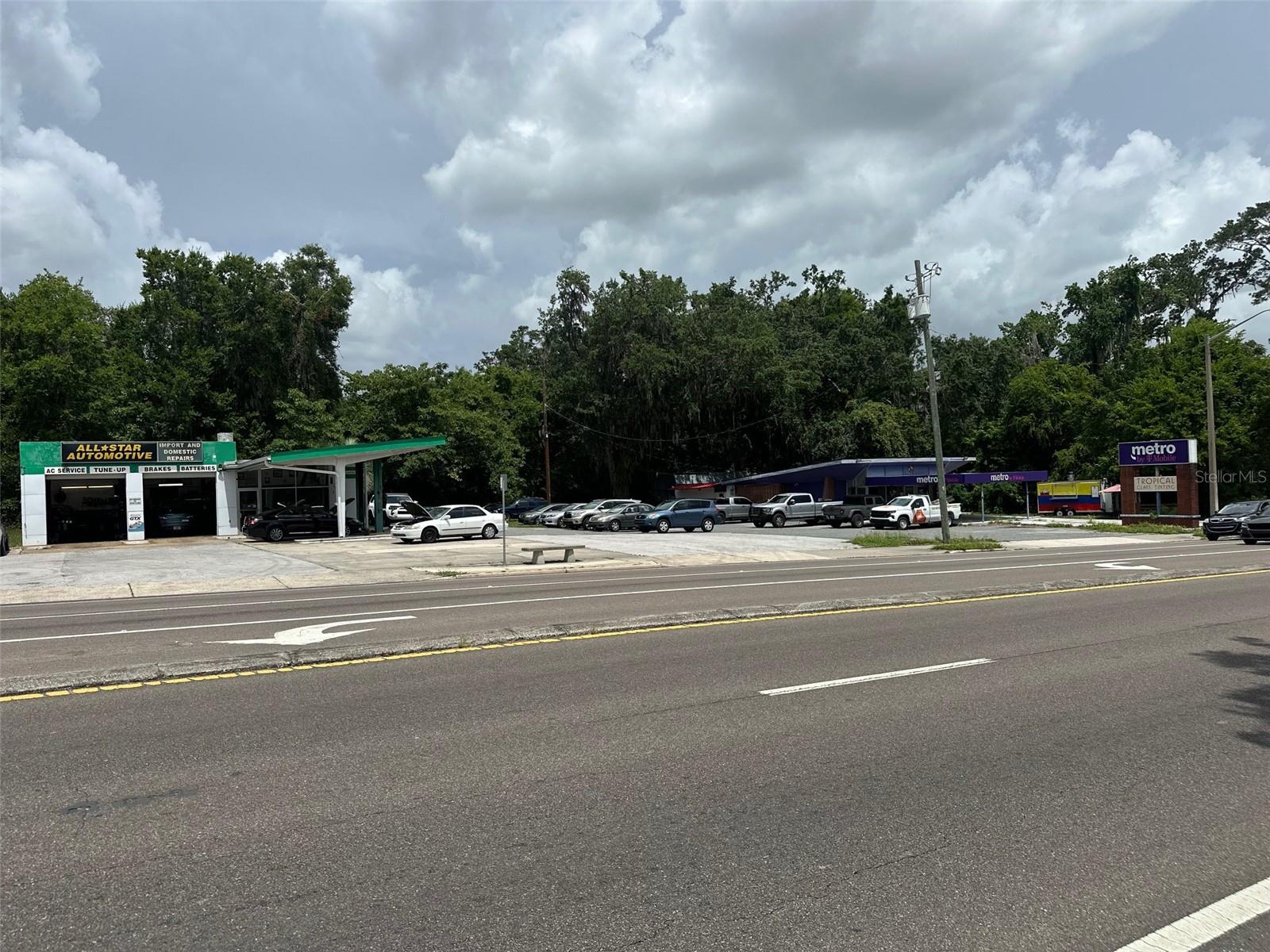 Commercial property assemblage (5 parcels) totaling 1.51 acres for sale on highly traveled NW 13th St. Frontage and access from 13th St. There are two buildings on the property - currently leased by All-Star Automotive and Metro by T-Mobile. Property is ideal for mixed use and multifamily development.