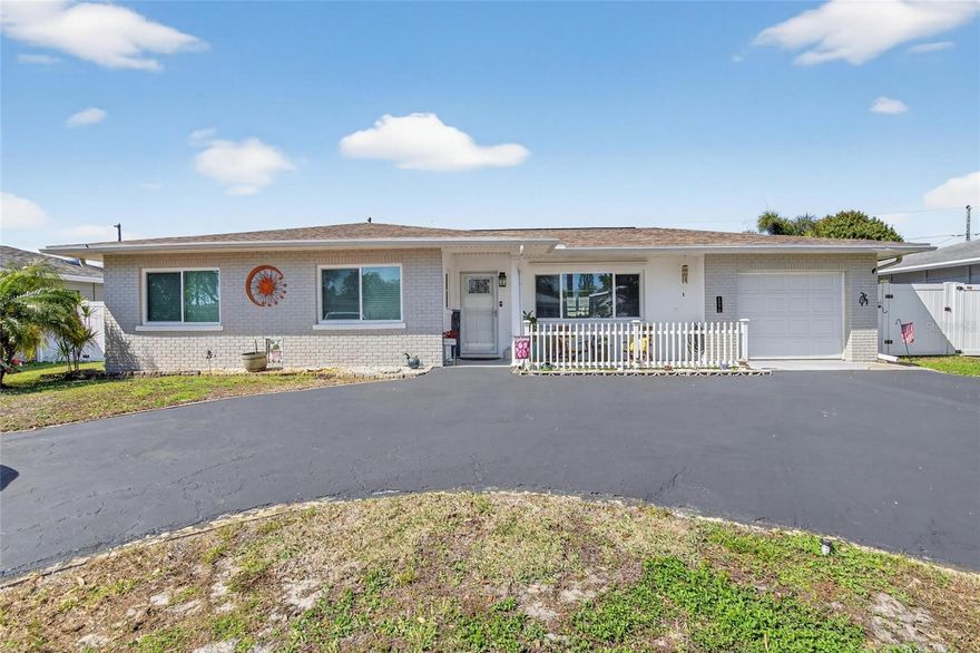 Welcome to this charming single-story home just minutes from the beach! This well-maintained 3-bedroom, 2-bath residence offers comfortable one-level living with numerous major updates already completed for peace of mind.

The home features a remodeled kitchen with granite countertops and updated appliances (2017), perfect for everyday living and entertaining. Hurricane-rated windows and exterior doors installed in 2017 provide added security and energy efficiency, while a new HVAC system (2017) keeps the home comfortable year-round. Additional improvements include a new garage door (2019), new water heater, and an updated Florida room with a new roof (2024)—creating a bright and versatile space for relaxing or hosting guests.

Outside, the property offers great curb appeal with a circular driveway and front-porch sitting area and a large, flat backyard ideal for entertaining, outdoor games, or future enhancements. A shaded pergola area creates the perfect spot to unwind or dine outdoors. A new irrigation system and brand-new roof installed in 2025 gives buyers confidence in the home's long-term durability.

Located less than 2 miles from the beach, this property offers the perfect balance of coastal living and everyday convenience. Situated in unincorporated St. Petersburg, the home benefits from no short-term rental restrictions, making it an excellent option for full-time residents, vacation homeowners, or investors seeking income potential.

Don’t miss the opportunity to own a move-in ready home near the Gulf beaches.