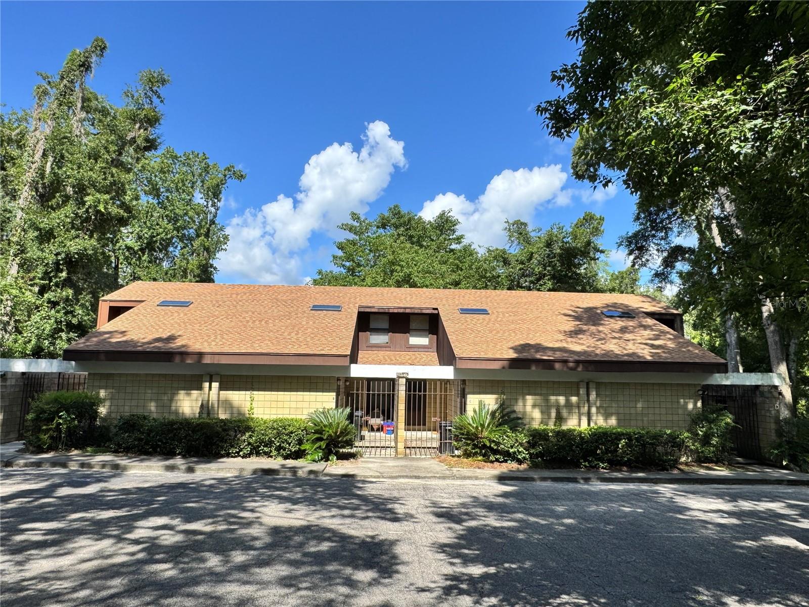 Updated 2BR/2BA end-unit condo in Greenleaf. This well-maintained condo features an open floor plan with vaulted ceilings, tile and luxury laminate flooring throughout (no carpet), and a partially fenced, private backyard patio. The kitchen includes ample cabinetry, pantry with lots of additional shelving, water filtration system under the kitchen sink and a breakfast bar overlooking the living and dining areas. Downstairs is a hall bath and a spacious bedroom with generous closet space; the primary suite(upstairs) offers an en-suite bath, double closets and an additional bonus room perfect for walk in closet, nursery, office and more. The living room features ceilings that are 2 story high and a full wall of sliding glass windows that leads you out to your covered back deck.
Recent upgrades include newer HVAC-2018, paint-2025 and the roof was replaced 2023. Conveniently located near UF, Shands, Butler Plaza, Celebration Pointe, and I-75. On bus route. HOA dues include your building hazard insurance as well. Ideal for owner-occupants or investors (projected monthly rent $1,400+/-)