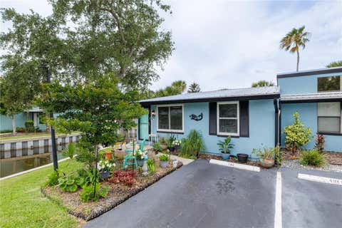 Photo of 100 Poinciana Cove Court #100, New Smyrna Beach, FL 32169 (MLS # O6416012)