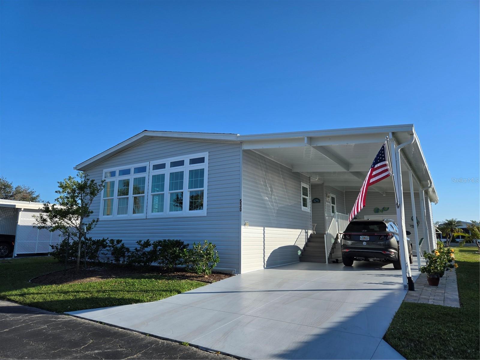 Welcome to this beautiful 2021 Jacobsen built, manufactured home, located in a highly sought-after maintenance-free community. This home combines modern design with luxurious finishes, offering both comfort and style. As you step inside, you’ll immediately notice the high-end features, including luxury vinyl flooring throughout, crown molding that adds an elegant touch, and neutral color tones that create a warm and inviting atmosphere. The home is bathed in natural light, thanks to plenty of windows that brighten up every room. The spacious kitchen is a dream, complete with upgraded cabinets, a built-in oven, stainless steel appliances, and a cooktop stove with a large island perfect for meal prep or entertaining. A beautiful wine bar adds a touch of sophistication, ideal for wine lovers or as a cozy spot for enjoying your favorite drinks. The primary suite is a true retreat with an ensuite bath featuring dual sinks and a luxurious glass shower—the perfect place to unwind after a long day. Additional highlights of this home include a den, perfect for a home office or reading nook, and a laundry room with a sink and extra cabinets for storage. The large back porch offers a relaxing outdoor space to enjoy your surroundings, while the carport ensures your vehicle is protected from the elements. For all your storage needs, you’ll love the large shed with overhead storage and the storage under the steps, providing ample space to keep your belongings organized. This home truly has it all: modern features, ample storage, and a convenient location in a maintenance-free community. Sandalwood Park…..located in the heart of Venice…..is a very active 55+ neighborhood with tons of social gatherings, a pool, shuffleboard, putting green, bocce courts, horseshoes, library and onsite office. Enjoy all Venice has to offer…..beautiful sandy beaches, golf courses, historic downtown, the legacy trail, parks, wonderful restaurants and shopping. Don’t miss out on the chance to make this exceptional property your new home! For more details or to schedule a viewing, contact us today!