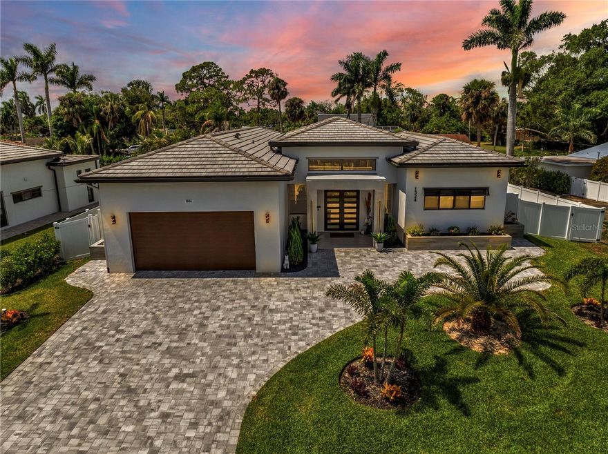 Experience refined Florida living in this exceptional custom-built residence, ideally located in the sought-after McGregor Corridor—one of Fort Myers' most iconic and desirable neighborhoods. As one of the few newly constructed homes in the area, this property offers peace of mind with modern building standards, including an 8-foot elevation, hurricane-impact windows and doors, and no history of flooding during recent storms.

Designed for both elegance and functionality, this nearly 2,700 sq ft home features 3 spacious bedrooms, each with its own en-suite bathroom and walk-in closet, along with a versatile den—perfect for a home office or guest space. The primary suite is a serene retreat with a spa-inspired bathroom and a custom walk-in closet. Slate tile floors throughout the home offer a seamless, sophisticated look, while high-end finishes elevate every space. An additional full bathroom is ideal for guests.

The gourmet kitchen is a chef’s dream, complete with Bosch appliances, sleek Italian-style cabinetry, and a striking waterfall island that makes entertaining a joy. Expansive sliding doors open to a covered lanai, now enhanced with a 27-foot awning for shade and comfort. The saltwater pool is framed by paver and travertine tile, while a newly added 16-foot walkway leads to a cozy fire pit area—perfect for relaxing under the stars.

Additional upgrades include a full interior repaint, updated window treatments, a central vacuum system, integrated security system, and full video surveillance for added peace of mind. The home is truly move-in ready and blends luxury, privacy, and efficiency.

Just minutes from the Edison & Ford Winter Estates, downtown Fort Myers, pristine beaches, shopping, and top-rated schools, this property offers an unparalleled lifestyle in a premier location. Don’t miss this rare opportunity to own a newer-construction home with timeless appeal and cutting-edge comfort.