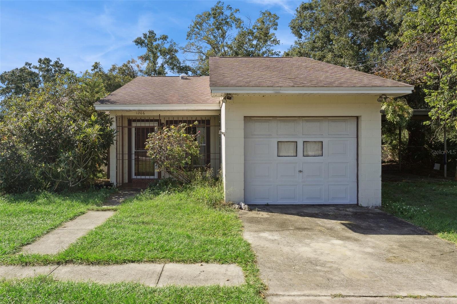 Great investment opportunity near Baldwin Park! No HOA, great fixer-upper on 0.35-acre corner lot off Old Cheney/Coletta Dr in downtown Orlando! Conveniently located near SR-50, SR-436, and the 417, you are only a short drive to shops and dining at Baldwin Park, UCF, downtown Orlando, the airport, and Altamonte Springs. This one-story home has great bones, with solid concrete block construction, hardiboard plank siding, three bedrooms, two full bathrooms, an open kitchen to the great room with a wood-burning fireplace, a den, and another bonus room. The roof is only eight years old, the house has been replumbed, the home is on public water and sewer, and the dishwasher is only one year old. The large, fenced-in corner lot is perfect for parking oversized trucks and RVs. This yard is ideal for dog lovers with multiple dogs. No HOA and a fenced 1/3 acre lot. There is an attached one-car garage and a four-car carport, perfect for your workshop or storage. This home needs a total refresh inside and new appliances, but the structure, functional layout, location, no septic or well, no HOA, and oversized lot make this a GREAT home or investment.