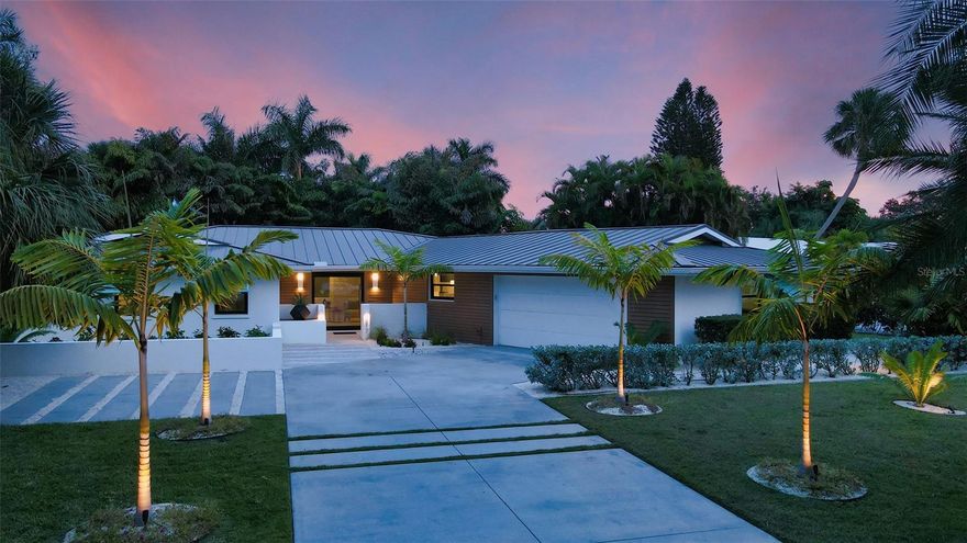 PRICE IMPROVEMENT ON THIS BEAUTIFUL HOME! Indulge in luxury at this stunning pool home in the sought-after Bird Key community. New tropical landscaping beckons, offering a preview of the beauty within. Originally renovated by Ampersana Construction and Sawa Design Studio in 2014, this home has been elevated to a showplace in 2023, and features ALL NEW PGT HURRICANE IMPACT RATED WINDOWS AND DOORS throughout the home.  Step through the Unique Custom Pivot Hurricane Impact Rated Front Door to a gracious entry, where the tropical views of the private backyard draw you through Newly Installed PGT Hurricane Impact French Doors, seamlessly blending indoor and outdoor living. The backyard haven boasts a generous patio, a sparkling Heated Saltwater pool with PebbleTec finish, and underwater Jandy lighting- an idyllic setting with beautifully updated landscaping featuring a new lighting system to highlight the mature palms dancing in the gentle winds in the evenings. Inside, the open floor plan captivates with a living area with gas fireplace, adorned with updated Designer surround, and custom cabinetry on both sides, then seamlessly transitions to the dining area, which impresses with Designer Luceplan Chandelier, along with Skylights, and Scandinavian Wallpaper Accent Walls, to set a warm ambiance for dining and entertaining. The built in Quartz topped Dining Buffet provides an ample serving area, and additional storage, for entertaining in style. The kitchen is a Culinary Delight, boasting a natural quartz waterfall island with seating, wood cabinetry by Campbell Cabinets, sleek quart countertops, counter to ceiling Marble Backsplash, and sleek stainless steel appliances, featuring an induction range. The primary suite is a Sumptuous retreat, also with French Door Access to the back yard, with ensuite with dual vanities, a rejuvenating walk in shower, and a generous walk in closet with California Closet Systems (in all bedroom closets).  The other two bedrooms are opposite the primary, ensuring privacy and comfort. One of the two secondary bedrooms offers an ensuite bathroom and ample closet, while the third bedroom, also with generous closet, provides views of the lovely side yard. The separate office/ den will be your favorite place to curl up with a book and could be converted to a 4th bedroom. There is also a separate Laundry Room with laundry sink. The Attached two car garage, with a Gardener’s Utility Half Bath, has also been updated with Hurricane Impact window and side door, the garage door is also PGT Hurricane Impact Rated. The flooring has been Epoxy coated.  Other updates to this Special Home include Updated Plumbing and Electrical, (2) 2023 Water Heaters, Designer Fans and Recessed LED Lighting throughout the home, Landscape Irrigation with a French Drain System, Freshly painted inside and out, Newly Stained Wood Exterior, New Designer Exterior Wall Sconces. (Full list of upgrades/ updates available). Bird Key, Sarasota's gem, is conveniently situated near downtown, boasting top-notch amenities such as world-class shopping, dining, cultural venues, A-rated schools, and hospitals. Beach enthusiasts can relish the proximity to Lido Beach and the vibrant scene at St. Armands Circle. The Bird Key Yacht Club provides a hub for social activities, dining, pool, fitness, and marina services.  Call to see this Fantastic Home Today!