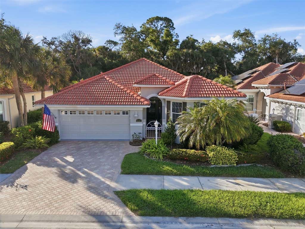 Photo of 5127 Hanging Moss Lane, Sarasota, FL 34238 (MLS # OM730682)