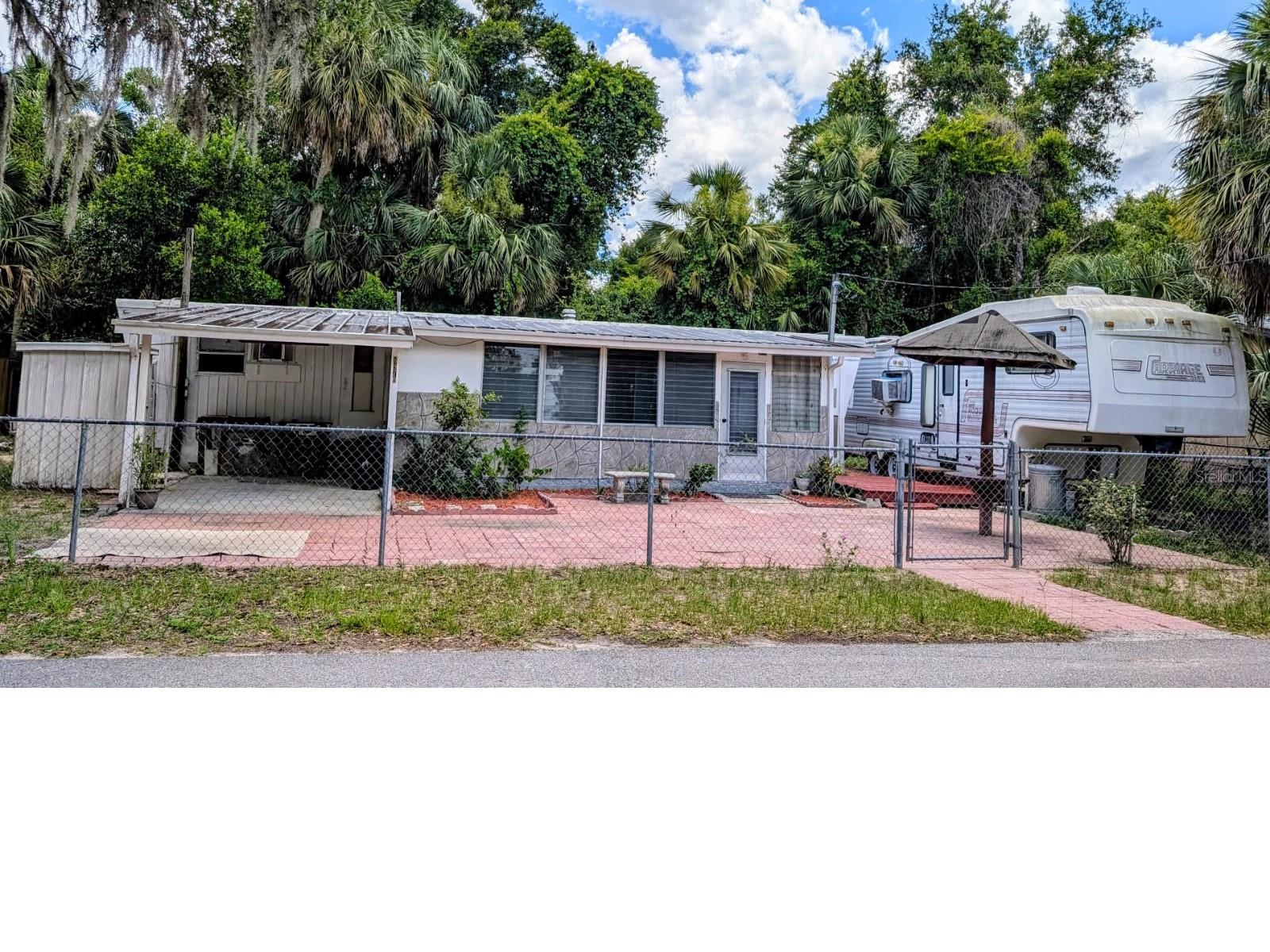 Heres your chance to have 2 separate living quarters with NO LOT RENT at an affordable price.
House includes 1 Bed 1.5 bath with Lanai. RV includes 1 Bed 1 Bath
Recent updates include lumbing, electric, hot water heater, new A/C window unit & full house water filtration system.
Property is move-in ready & has remained dry after many hurricaines.
Citrus county has low taxes for homeowners & is tucked away from traffic yet close to everything you could ever need. The beach and airport are a short drive away. The area is known for breathtaking crystal clear springs, kayaking, hiking and fishing in the bay at Crystal River. Plent of shopping & restaurants nearby as well.
CASH ONLY DUE TO YEAR OF MOBILE