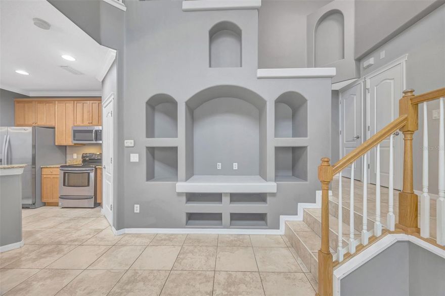 Welcome home to this stunning 2 bedroom, 2.5 bath luxury condo in the highly sought after GARDEN DISTRICT of coveted FISHHAWK RANCH! This luxury tri-level condominium offers a great layout, exquisite design and soaring ceilings, providing a feeling of spaciousness that far exceeds the square footage! You are sure to love the attention to detail, architectural beauty, built-in niches in the great room, and crown moulding throughout. This amazing home is a true show-stopper and a MUST SEE! The additional loft space is a great bonus, making it a perfect play room for the little ones, hang out space for the teens, yoga or workout space, or an office space for someone who works from home. This gem has it all! Downstairs is your primary living space, with open sight lines, ceramic tile throughout, and an open, spacious floor plan. The kitchen boasts real wood cabinetry with 42-inch uppers, granite countertops, stainless steel appliances, pantry closet, and breakfast bar seating adjacent to the open dining room. Upstairs you will find the loft and guest bedroom, each with direct access to the screened-in balcony, a full bathroom with real wood cabinets and granite counters, the beautiful primary suite, featuring a large garden tub, separate shower, water closet, granite counters in the dual sink wood vanity, and a large walk-in closet. The laundry room is conveniently located upstairs. There is plenty of storage for your cars, bikes, and hiking gear in the 2-car garage. The roof and dual-zoned HVAC were replaced 6 years ago, making it move-in ready! This incredible home is conveniently located DIRECTLY ACROSS from Park Square, where you can walk to local restaurants and shops. Amenities include numerous resort style pools, miles of biking / hiking trails, tennis, basketball courts, playgrounds, dog parks, gym, year-round events, and access to all of the niceties and conveniences Fishhawk has to offer, making this a perfect home for an active owner or a fabulous investment property! CALL TODAY! Units are rarely available in this location, and it surely WILL NOT LAST!