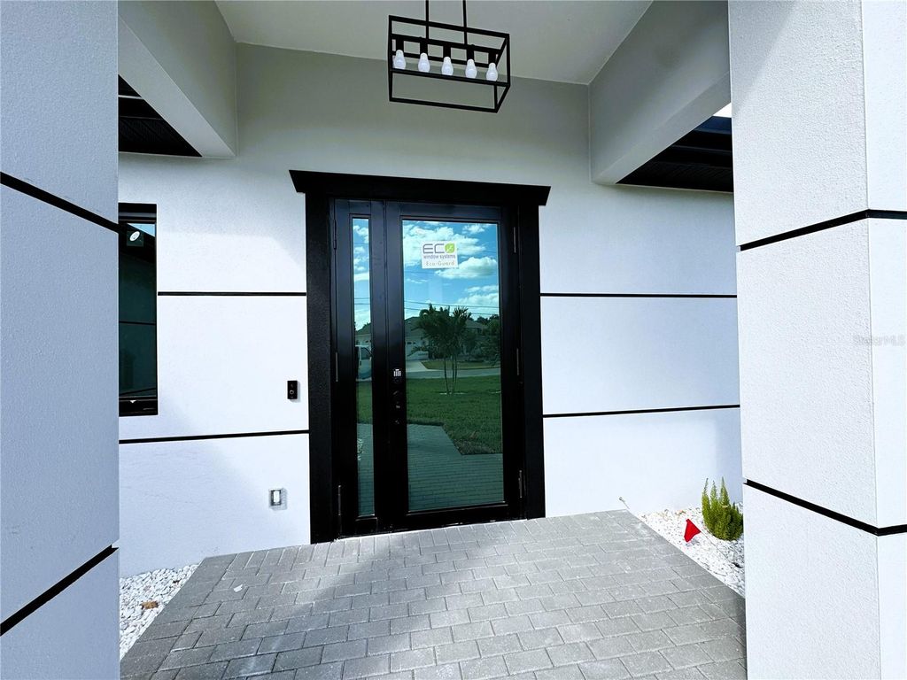 Photo of 313 SE 31st Terrace, Cape Coral, FL 33904 (MLS # TB8442993)