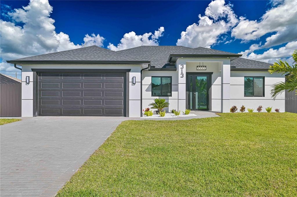 Photo of 313 SE 31st Terrace, Cape Coral, FL 33904 (MLS # TB8442993)