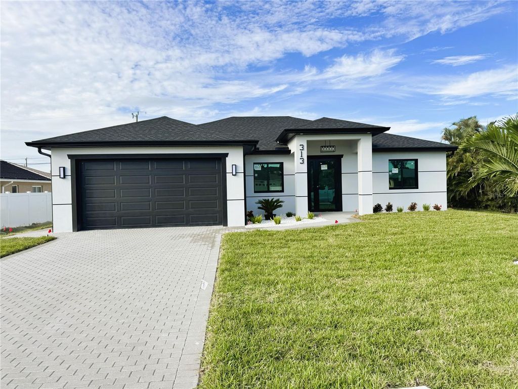 Photo of 313 SE 31st Terrace, Cape Coral, FL 33904 (MLS # TB8442993)