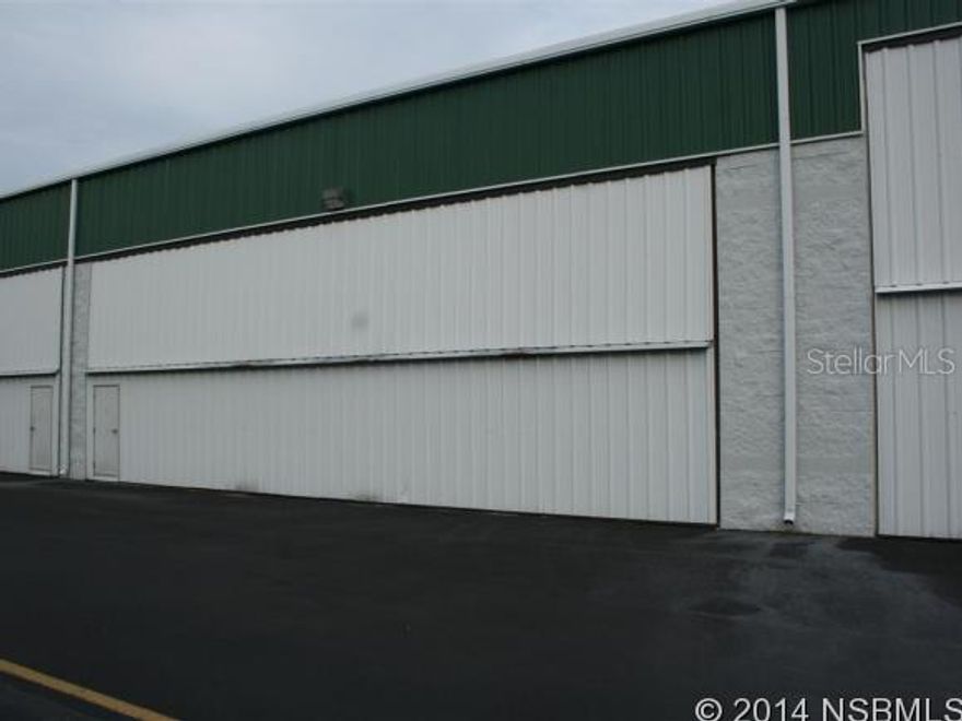 A Commercial Condo Hangar located in the Spruce Creek Fly-In Community on Aces Alley...The Spruce Creek Fly-In is located south of Daytona Beach, 8 miles to the Ocean and Intra-Coastal and 1 hour to the Orlando Airport....The Hangar is 50'X52' with a door  opening of 48'4"X13'4"....The Hangar has a 1/2 Bath....The Spruce Creek Fly-In Community offers 24 hour manned and gated security, a 4,000' Runway with a GPS Approach, the Downwind Cafe Restaurant is on the field.... There are several locations for obtaining both 100LL or  Jet fuel....Residential Condos as well as Single Family Homes from $150,000 to $2,850,000. are available....In addition, Memberships in the Spruce Creek Country Club are also available...The quarterly condo fee for the Crosswind Hangar Assoc. is $690.00. In addition, the Spruce Creek HOA fee is $1,350.00. paid annually. ;Water: City