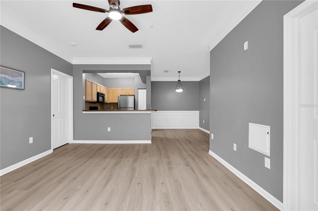 Photo of 12837 Madison Pointe Circle #204, Orlando, FL 32821 (MLS # O6451206)