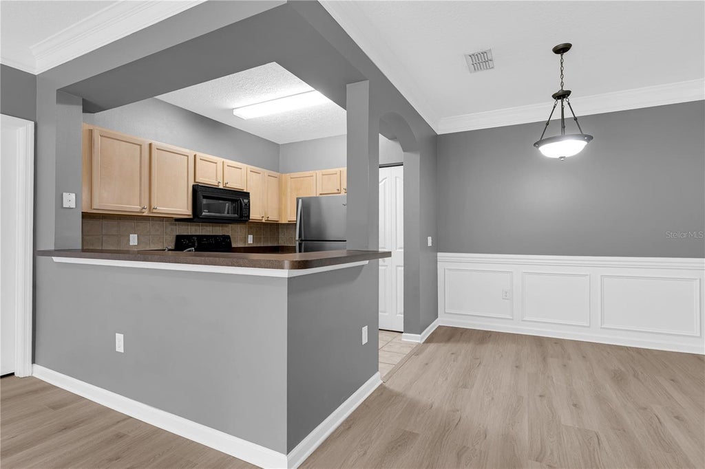 Photo of 12837 Madison Pointe Circle #204, Orlando, FL 32821 (MLS # O6451206)