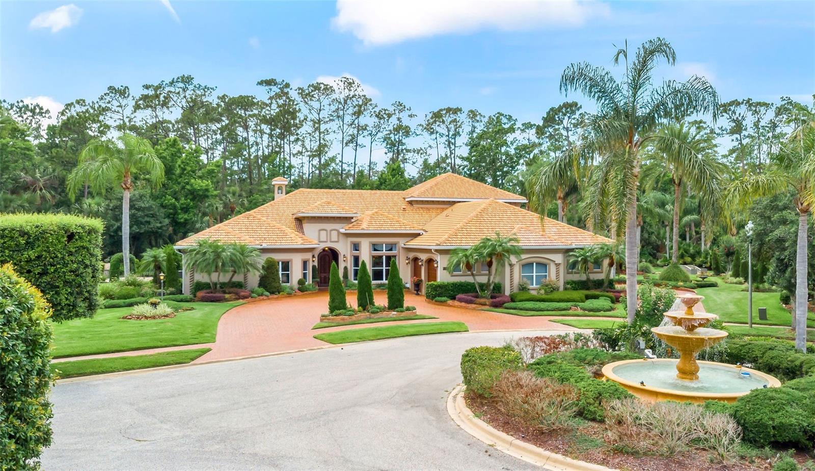 Have you wished for an opportunity to own one of the first and most prestigious estate residences in all of Venetian Bay, but hadn't yet found your chance? Listed for the first time on the market is this truly luxurious residence that is an absolute symphony of style and grace. Custom built with tremendous care by the original owners, this Johnson Group estate home sits gracefully on one of the most private and coveted lots in the gated section of Venetian Bay known as Tuscany Reserve. The home rests proudly on a private cul de sac, where you can hear the bubbling fountains and see the abundance of meticulously managed gardens and manicured landscaping. Behind the home is not only an estate-sized pool and pavered pool deck area with a gas summer kitchen, but you will also find the home is perched on a wooded preserve, allowing you all the privacy you expect in a distinguished neighborhood. As you drive up the circular drive to the front, you are greeted by a magnificent wooden entry door that leads you to more than 4,600 square feet of living area under air. When you enter the living room, your eye is taken to the amazing, customized columns, the coffered ceilings, the wood beams, numerous elegant blinds and window treatments and luxurious silk drapes. The living area is abundant yet intimate and comfortable, featuring built-in display cabinets, voluminous windows, and French doors leading to the outdoor, fully covered and screened entertaining areas and the dramatic and elegant pool. The fully open and split floor plan offers a chef's kitchen open to the living and dining rooms, as well as a very functional butler's pantry area with an ice maker and beverage center. The kitchen features a separate breakfast dining area overlooking the pool, a gas stove with a dramatic hood vent, a built-in refrigerator, beautiful wood cabinets, stainless appliances, sparkling granite, an island and breakfast bar style seating - and even a pot filler and a walk-in pantry. The home also features a formal dining area and a dedicated office, each with its own unique and very meticulous paint and textural style, as well as dramatically beautiful woodwork and window treatments. With an open & split floor plan, this spacious four-bedroom, four-bathroom home, with a separate, dedicated office, offers a wealth of options for entertaining and also privacy and a good flow for guests to visit. As you pass the custom wood paneled library/reading nook area, you will see the stairs leading to the second-floor wing, which offers a private guest room and bath, as well as a large room to be used as a den, game room, exercise room, oversized office, home theater area and more. From the second story, you also have a perfect view of the pool and spa, the preserve and a water view, as well. The Owners' bedroom with gorgeous, coffered ceilings and an en-suite bath is complete with a Roman tub, an enormous walk-in shower, and a large walk-in closet. Add to this the three additional, large bedrooms and additional, three full baths, and you have space to hosts guests or for a large family or extended family arrangement. The garage offers room for four cars easily. This home has been updated with three brand-new A/C systems (2025), two brand-new hot water heaters (2025), a 45kw wired full house generator, two 250 gallon propane tanks, and a very secure safe room which was a Johnson Group hallmark!
