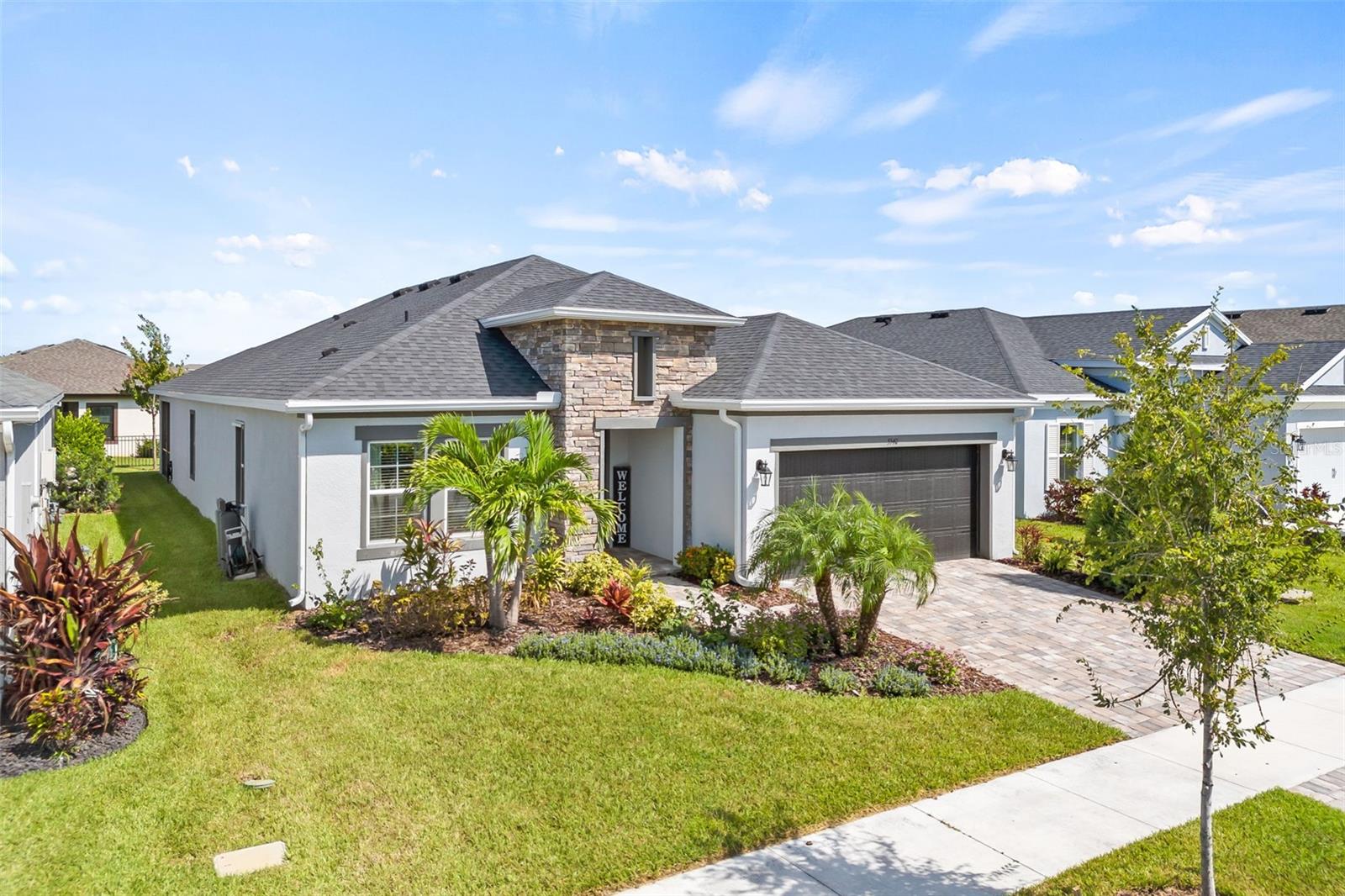Veteran owned and recently back on the market. 4% Seller's concession to be used towards closing costs, prepaids or buydowns! Cardel's South Hampton II, Located in the heart of Waterset, one of the most desirable communities in the Southshore area of Tampa Bay. This nearly brand-new home was built in 2022 and offers a comfortable and flexible single level floorplan with four bedrooms, three full bathrooms, a study/den and a large bonus room. The spacious open floorplan includes a gourmet kitchen with an over the stove stainless-steel range hood and stainless-steel appliances, built-in oven and microwave, walk in pantry, Cambria quartz countertops, plank tile floors, oversized cabinets with extra storage under the kitchen/bar area. What a perfect plan for entertaining guests! A large bonus room/optional formal dining area is situation off to the side of the kitchen/living area. Off of the living room, the master ensuite door leads to a spacious owner's retreat including a walk-in shower, upgraded soaker tub, dual vanities and large walk-in closet. The extended and covered lanai is screened and includes brick pavers. The oversized slider and master bedroom windows have been professionally tinted with eco-friendly film to cut down on your electricity bill in the Florida heat. A nearly new water softener was installed last year. Additionally, the community amenities include three pools, water slides, a splash pad, two clubhouses, dog parks, 14 miles of scenic paved trails throughout the neighborhood and adjacent nature preserve, two state of the art fitness centers and even a neighborhood internet cafe to grab a quick cup of coffee or lunch with friends. All conveniently located near the I-75 corridor with an easy commute to Tampa, MacDill AFB, Bradenton and Sarasota beaches! You won't want to miss this opportunity to live your best Florida lifestyle!