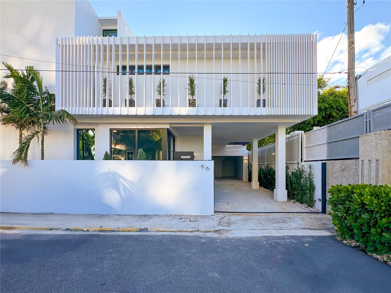 A brand-new architectural masterpiece designed for modern living in the heart of Condado. Strategically located just steps from the top private schools in the area, this 4-bedroom, 7-bath residence redefines luxury with a perfect balance of elegance, comfort, and performance.
From the moment you arrive, soaring ceilings, sun-drenched interiors, and open-concept spaces set the tone for a home that celebrates both style and functionality. Designed for entertaining as well as everyday living, the residence features generous social areas, a rooftop terrace with outdoor kitchen, and a pool—creating the ultimate setting for relaxation and connection.
Every detail whispers sophistication: floor-to-ceiling windows, sleek finishes, and a layout planned to enhance everyday life. Beyond its beauty, the property offers peace of mind and self-sufficiency with a full-power generator, water cistern, and covered garage.
Nestled within one of San Juan’s most exclusive residential enclaves, Placid Court 66 offers more than just a home—it offers a lifestyle. Whether hosting friends under the stars, working from a bright, private office, or retreating to your poolside oasis, this residence adapts effortlessly to every occasion, exceeding expectations at every turn.