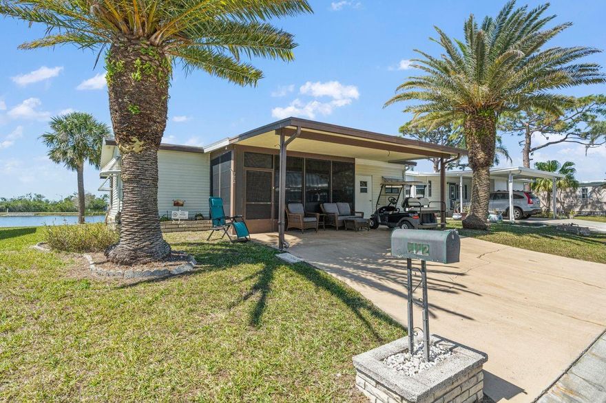 MOTIVATED SELLER and PRICE JUST REDUCED over $14K! Live the LAKEFRONT dream in this adorable 2-bedroom, 2-bath home in the desirable 55+ GULF ACCESS community of Harbor Cove. Imagine enjoying dinner or happy hour beverages from your 32-foot long LAKESIDE enclosed lanai watching breathtaking sunsets over the water! The 1,146 sq. ft. of interior living space includes the 320 sq. ft. air conditioned lanai. Wildlife viewing is a rewarding everyday occurrence here. This charming cottage style home features vaulted ceilings and attractive low-maintenance laminate flooring with both the living room and primary suite having direct lanai access and views. Tons of closet space in both bedrooms and the primary has an ensuite bathroom with walk in shower. Nice dining area adjacent to the kitchen and the small office nook has many possibilities. Updates include the kitchen range and microwave, newer roof (2023) and all windows replaced (2017). In front find a carport, covered screened porch and storage shed. Most furnishings are included. With HOA fees of only $150/month, including lawn mowing, a Membership Share and seawall maintenance, you'll have more time to indulge in the incredible amenities: two pools, a spa, tennis, pickle ball, shuffleboard, bocce courts, billiards, fishing  and a fitness center. The huge 2-story activities center overlooking the 90-slip marina hosts dances, parties, picnics, card games and more. You’ll have Gulf access via the Myakka River and can rent a boat slip for just $100 a year! Dining, shopping, medical services, parks and beaches are a short drive away. Don't miss out on this opportunity to live the resort lifestyle at an affordable price!