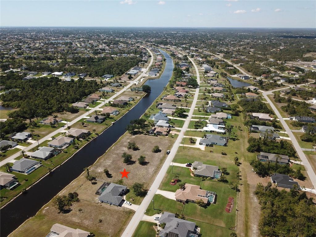 Photo of 828 Boundary Boulevard, Rotonda West, FL 33947 (MLS # C7508591)
