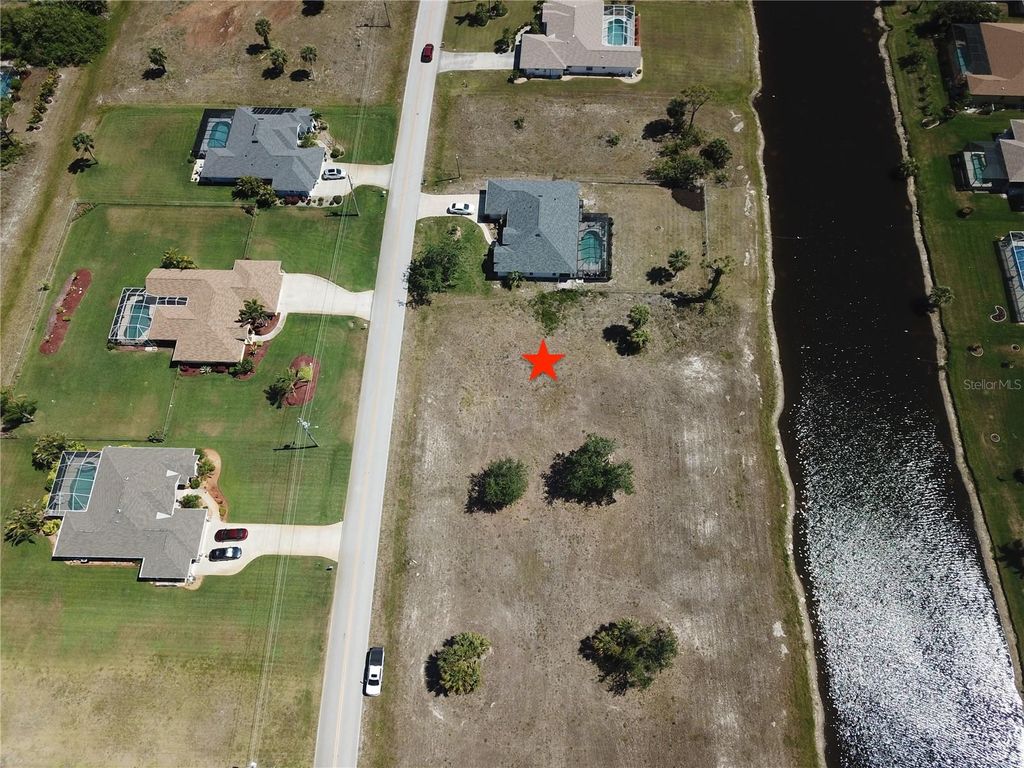 Photo of 828 Boundary Boulevard, Rotonda West, FL 33947 (MLS # C7508591)