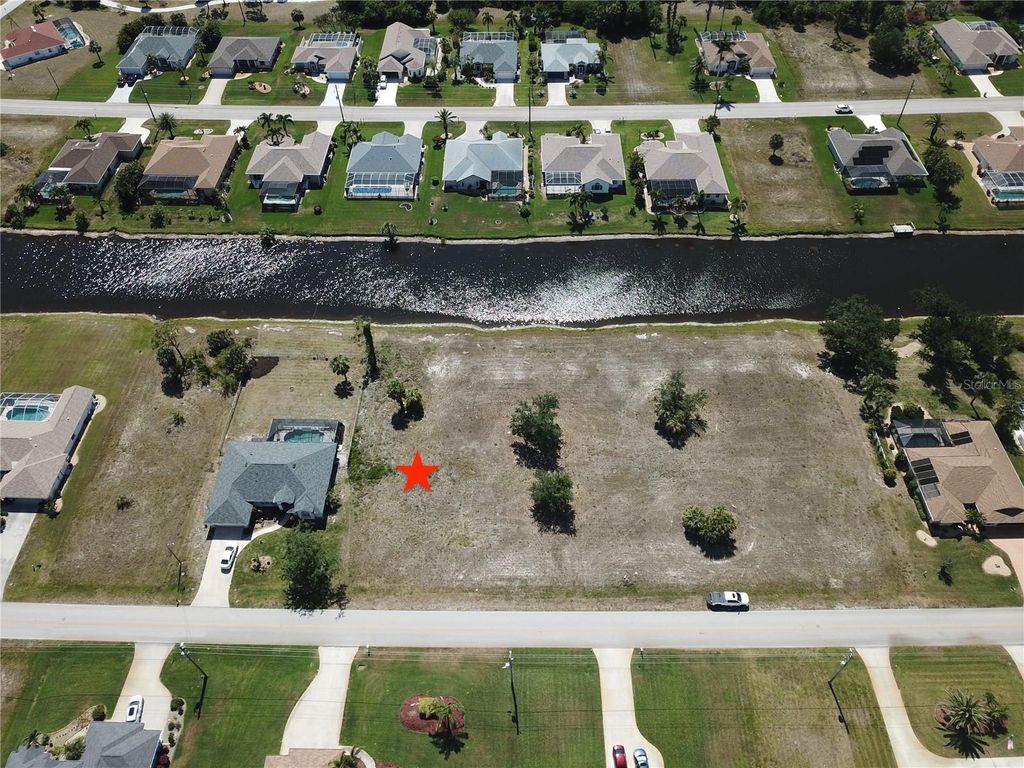 Photo of 828 Boundary Boulevard, Rotonda West, FL 33947 (MLS # C7508591)