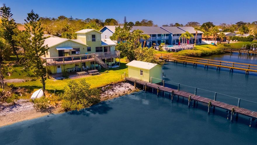 Commercially zoned half acre property with 129’ on the Intracoastal with deep water dock and boat shed offering the ability to redevelop into a boutique hotel, mini-marina or new home with rental units.  The upstairs features 3 bedrooms 2 baths.  The 2 bedroom, 1 bath apartment on the first level was livable until most recent flooding and after repairs from prior flooding.  Large salt pool not in use but had new pump and filter replaced in 2022.  Electric was redone is 2022.   There are 3 electric meters and the zoning is ideal for B&B or income property. Known as the Seven Mile Fish Camp, City of Edgewater Merchant/Retail Business Tax Receipt and Commercial Certificate of Use are both up to date.  B-4 Tourist Commercial Zoning is intended for short term waterfront accommodations and includes residential mixed-use. Permitted uses include Bed and Breakfast, Hotel/Motel, Marina and more. ;Water: City