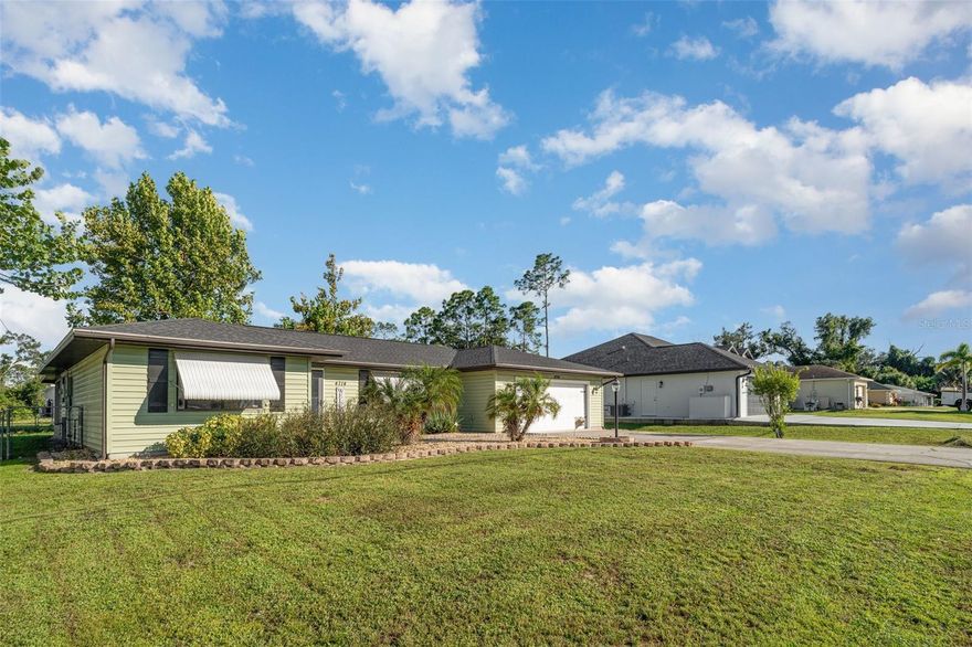 4% Assumable Mortgage Available! Move-in ready and beautifully updated! This charming 3-bedroom, 2-bathroom single-family home in North Port offers the perfect blend of comfort, style, and location. Step inside to a bright open-concept floor plan with cathedral ceilings, new hardwood flooring, and fresh carpet throughout. The updated kitchen features custom tile counters, plenty of cabinet space, and an easy flow into the dining and living areas—ideal for entertaining or everyday living. The split-bedroom layout provides privacy for the spacious primary suite, complete with ample closet space and a private en-suite bathroom. Enjoy the Florida lifestyle on your screened lanai overlooking a peaceful backyard, perfect for morning coffee or evening relaxation. Recent upgrades include a new AC (2022) and water heater (2020), offering peace of mind for years to come. Situated in a quiet, non-HOA neighborhood, you’ll love the freedom of no deed restrictions and low-maintenance living. Conveniently located near Warm Mineral Springs, the North Port Aquatic Center, Blue Ridge Park, shopping, dining, and top-rated schools, this home delivers unbeatable value and everyday convenience. Don’t miss your opportunity to own a beautifully maintained, move-in ready home in one of Southwest Florida’s fastest-growing communities!