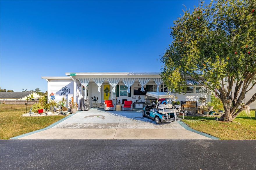 Welcome to Spanish Trails West, a beautiful gem in Zephyrhills offering a vibrant 55+ resident-owned community where you can enjoy full ownership with no lot rent and a low monthly HOA of just $142 covering cable TV, high-speed internet, lawn care, and trash removal. This stunning home features an open-concept layout that seamlessly connects the oversized living room, dining area, kitchen, and dinette, with durable laminate flooring throughout, waterproof vinyl plank in the bathrooms, and wood-like tile in the kitchen. The split-bedroom design provides privacy and comfort, with a master suite boasting a full-wall closet with stylish barn doors and a beautifully updated ensuite with a custom tile shower, while the second bedroom offers a walk-in closet and easy access to a full bath with shower/tub combo. Natural light fills every room through dome lights, and the bright Florida room with large windows and a portable AC unit ensures year-round enjoyment. Outside, the carport has been transformed into a charming front patio with new curtains and an adjacent storage shed with new lighting, while lush landscaping, solar-powered lights, fruit trees, shade awnings, and hurricane shutters enhance the property’s charm and security. Thoughtful upgrades include a lifetime rubber roof, brand-new 3.5-ton AC, double-pane windows, recessed lighting, updated electrical switches and outlets, new water heater, crown molding, and smooth, polished walls, with a 1-year home warranty included for the next homeowner, making this home truly move-in ready. Residents enjoy exceptional community amenities including a heated pool, lively clubhouse, indoor shuffleboard, tennis and pickleball courts, a fenced dog run, and secure RV, boat, and trailer storage behind a locked gate, all just minutes from shopping, dining, and healthcare. This home is not just a residence—it’s a lifestyle, offering comfort, style, and the freedom of true ownership in sunny Florida.