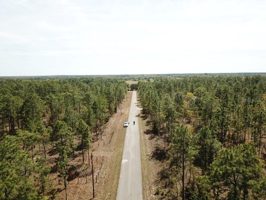 Looking for a spacious piece of land in a peaceful, outdoor-focused community? Look no further than this 1 acre property located on SE 138th Avenue in the Rainbow Lakes Estates neighborhood of Dunnellon, Florida. This property is located on a well paved road with great street frontage, electric power access on the street, mature trees, and in a neighborhood with no HOA. The community of Dunnellon, Florida is a great homebase for those looking to enjoy many of the nearby outdoor amenities such as Rainbow Springs State Park, Rainbow River, and KP Hole Park. Downtown Dunnellon also boasts several local restaurants and bars such as Lugo’s Grill, Don Pepe Mexican Restaurant, and Blue Gator Tiki Bar as well as name brand stores such as Publix, ALDI, and Walmart. This property is zoned RR-3C-Single Family Residential and allows for site-built homes, modular homes, or cabins. There is no HOA for Rainbow Lakes Estates. Electricity is available on 138th Avenue, but requires installation. A septic system and well/water tank are required. Living in mobile homes full-time is not allowed. There is a trailer located on the property that’s been in place for several years. Nearby Dunnellon, there’s plenty of fantastic places to visit such as the Crystal River waterfront, a lively downtown area with restaurants, bars, and live entertainment. Additionally, larger cities such as Ocala and Gainesville Florida are only a 40-50 minute drive away. Come enjoy your days exploring the Sunshine State with over 220 days of sunshine annually and warm summer highs of 95°. Check out this property today!