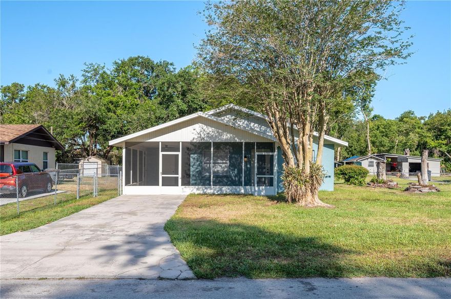 One or more photo(s) has been virtually staged. Prepare to fall in love! This cute-as-a-button home has been completely transformed from top to bottom! Out with the old, in with the new! This absolutely stunning home has been completely overhauled and updated, offering over 1,100 square feet of pristine living space (1,400+ total square feet) with 3 bedrooms and 2 beautifully modernized bathrooms. Step inside to find seamless new laminate flooring and elegant crown molding flowing throughout the entire home. The show-stopping kitchen is a chef’s dream, boasting new shaker cabinets, gleaming granite countertops, stainless steel appliances, garbage disposal, new sink, faucet, lighting and a striking black-and-white backsplash that encompasses the entire space. Both bathrooms feature gorgeous new vanities, new fixtures, new toilets, and classic subway tile. This home also features a separate, fully updated laundry room that now enjoys central A/C tied into the main home for year-round comfort. Home has been freshly painted inside and out, the home is outfitted with custom blinds throughout and a massive 20x11 screened-in porch perfect for outdoor living. Nice size fenced in back yard so bring your pets! Enjoy ultimate peace of mind with major mechanical upgrades, including a new roof (2023),  A/C (2018) with a brand-new UV light system (2026), a new water heater (2025), and a fully re-piped plumbing system with all-new shut-off valves. Completely turn-key and packed with style—schedule your showing today!