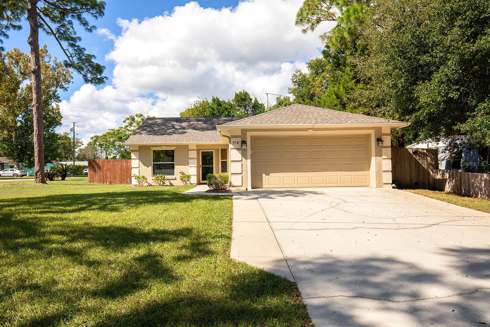 Welcome to 950 Spring Garden Street in Altamonte Springs, Florida a charming and meticulously maintained 3 bedroom, 2 bath home on a spacious corner lot with no HOA. Freedom to bring your cars, trucks & boat!   Located minutes from the vibrant Cranes Roost Park Altamonte Mall, and with easy access to I-4, this home offers both convenience and lifestyle.
Step inside to vaulted ceilings and a smart split-plan layout that blends privacy with flow. The open kitchen features 42" cabinets, stainless steel appliances, and plenty of counter space, ideal for everyday living and entertaining. Retreat to the generous primary suite with walk-in closet, a raised-vanity bath, separate shower and garden tub.
Outside, enjoy a fully-fenced backyard, a large covered patio with roll-down shades perfect for outdoor BBQ's or relaxed weekends. Recent updates include a new roof (2024), new hot water heater (2023), HVAC (2018), and an EV charger for modern convenience. The attached two car garage is immaculate, with epoxy flooring, built-in workbench and upper cabinets. A shed adds additional utility.
This location is exceptional!  Live minutes from Uptown Altamonte dining, movie theater, shopping and entertainment, yet enjoy the ease of being centrally situated between Orlando International Airport, area attractions, beaches and all that Central Florida offers.
With this combination of highly desirable location, move-in ready condition and no HOA constraints, this home represents a fantastic value in today’s market in Altamonte Springs.  Hurry come see!