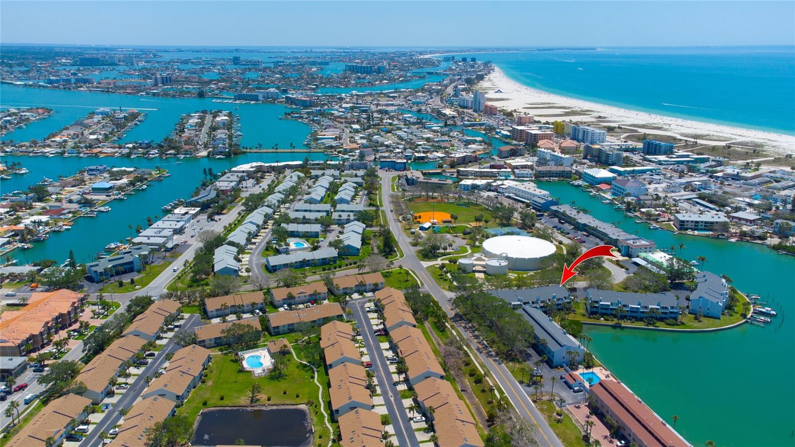 One or more photo(s) has been virtually staged. One or more photos have been virtually staged. The HOA includes flood insurance, with FEMA's prepaid coverage extending until 11/27/2027.
Welcome to your tropical sanctuary at the Isle of Capri in Treasure Island! This stunning waterfront townhome is embraced by swaying palms and the enchanting hues of turquoise waters. Each level presents picturesque vistas where dolphins and manatees frequently visit, inviting you to unwind in paradise. Exquisitely updated, this home awaits your personal touch.
The lower level features a two-car garage adorned with striking blue epoxy flooring, or it can serve as a versatile air-conditioned bonus room. Sliding doors open to a waterfront patio, perfect for hosting barbecue cookouts while you bask in your private, serene harbor view.
The living room, highlighted by a marble-surround wood-burning fireplace, flows gracefully onto a beautiful balcony where you can sip morning coffee overlooking the shimmering harbor. The modern kitchen is a chef’s dream, showcasing granite countertops, rich wood cabinets, a movable island, a pantry closet, and a breakfast bar.
On the third level, two radiant master suites boast polished wood floors, spacious and efficient California closets, vaulted ceilings, and luxurious granite-and-marble bathrooms. The waterfront master suite features a cedar wood vaulted ceiling, a new large jacuzzi tub, and a shower. Sliding doors lead to a private balcony with breathtaking water views.
Dive into the community's private pool, chilled in summer and heated in winter. Cast a line from the sea wall or explore Roselli Park’s tennis and pickleball courts, playground, and beautifully maintained dog park.
Just minutes from pristine Gulf beaches and a host of delightful restaurants, this pet-friendly haven welcomes your family to the vibrant lifestyle and adventures of island living—a true Florida paradise! Enjoy the peace of mind provided by a 2025 HVAC system and hurricane shutters.