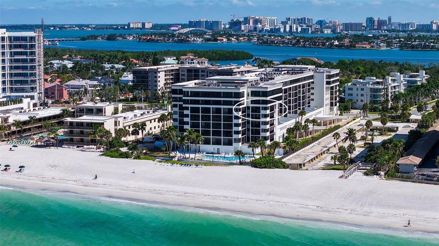 Luxurious Gulf-Front Corner Condo with Sweeping Views – Lido Surf & Sand. Experience the pinnacle of beachfront living in this rarely available southwest corner residence at Lido Surf & Sand, offering unparalleled panoramic views of the Gulf of Mexico, Lido Beach, and all the way to Siesta Key. Perched on the 6th floor of the coveted gulf-front atrium building, this 2-bedroom, 2-bathroom end-unit boasts 1,456 sq. ft. of elegant interior living space plus an additional 372 sq. ft. of expansive wraparound balconies—perfect for soaking in both sunrise and sunset. One of only four corner units per floor, this light-filled condo features floor-to-ceiling beach views from every main living space, creating a true indoor-outdoor lifestyle. The open-concept layout flows seamlessly from the dining area and spacious great room to the full-width beachfront balcony—ideal for both intimate evenings or entertaining a crowd. The custom gourmet galley kitchen is thoughtfully designed with beautiful countertops, custom lighted cabinetry, and generous storage, making it both beautiful and functional, new appliances, perfect for entertaining. Enjoy peace of mind with a new water heater (2023), brand new A/C unit, and upgraded hurricane-impact windows, sliders, and front door. Wake up to coffee on your private lanai with endless beach views or wind down with the gentle sounds of the surf in the evening. A newly planned social room will elevate your outdoor living experience even further. Just two blocks from a private nature preserve—perfect for peaceful walks or kayaking—and moments from St. Armands Circle, where you can explore boutique shopping and exceptional dining. Whether you're seeking a serene retreat or a vibrant coastal lifestyle, this one-of-a-kind residence offers the best of both. Your Lido Key beachfront lifestyle awaits. Schedule your private tour today.