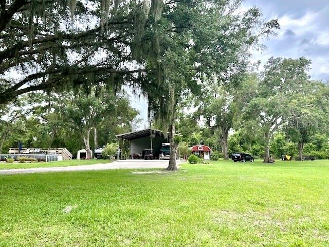 Photo of 528 Ashley Ln, Center Hill, FL 33514 (MLS # O6413674)